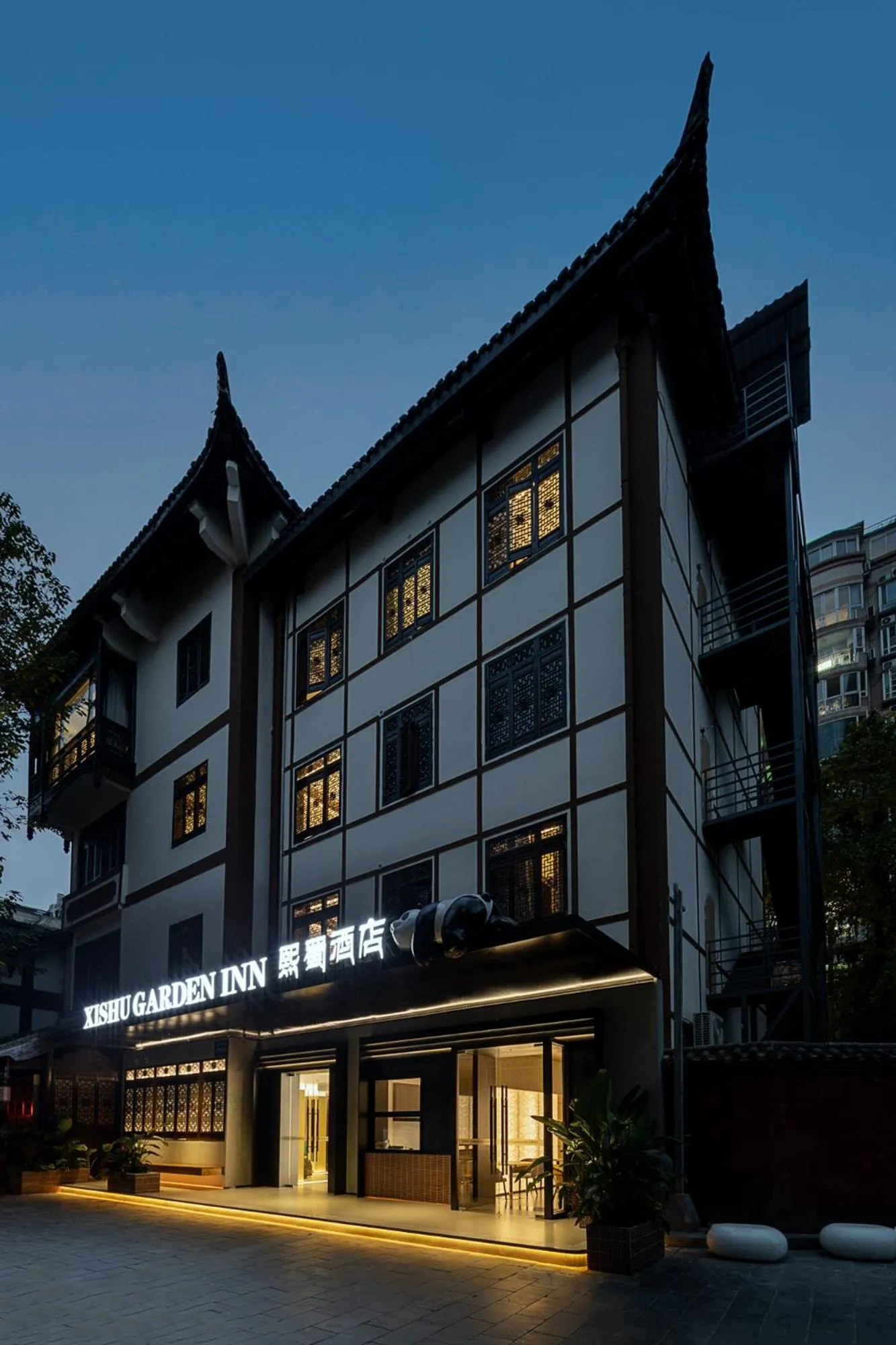 Property building in Xishu Garden Inn - Travel Agency service - Car Rent service - English Speaking