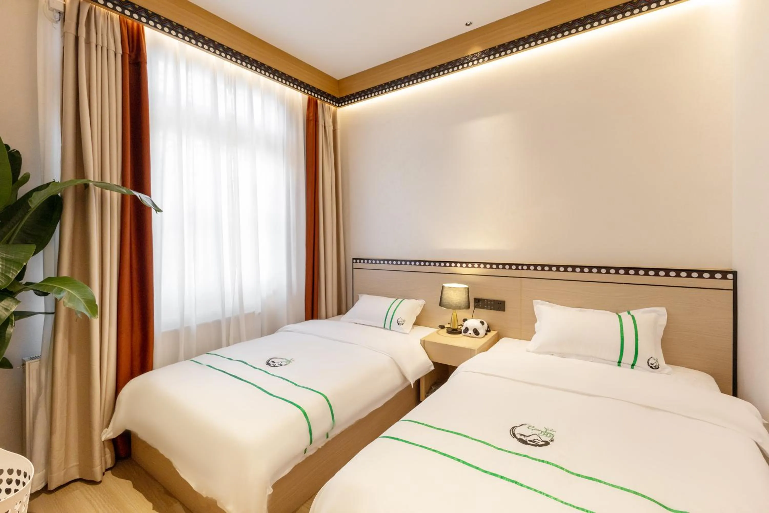 Bedroom, Bed in Xishu Garden Inn - Travel Agency service - Car Rent service - English Speaking
