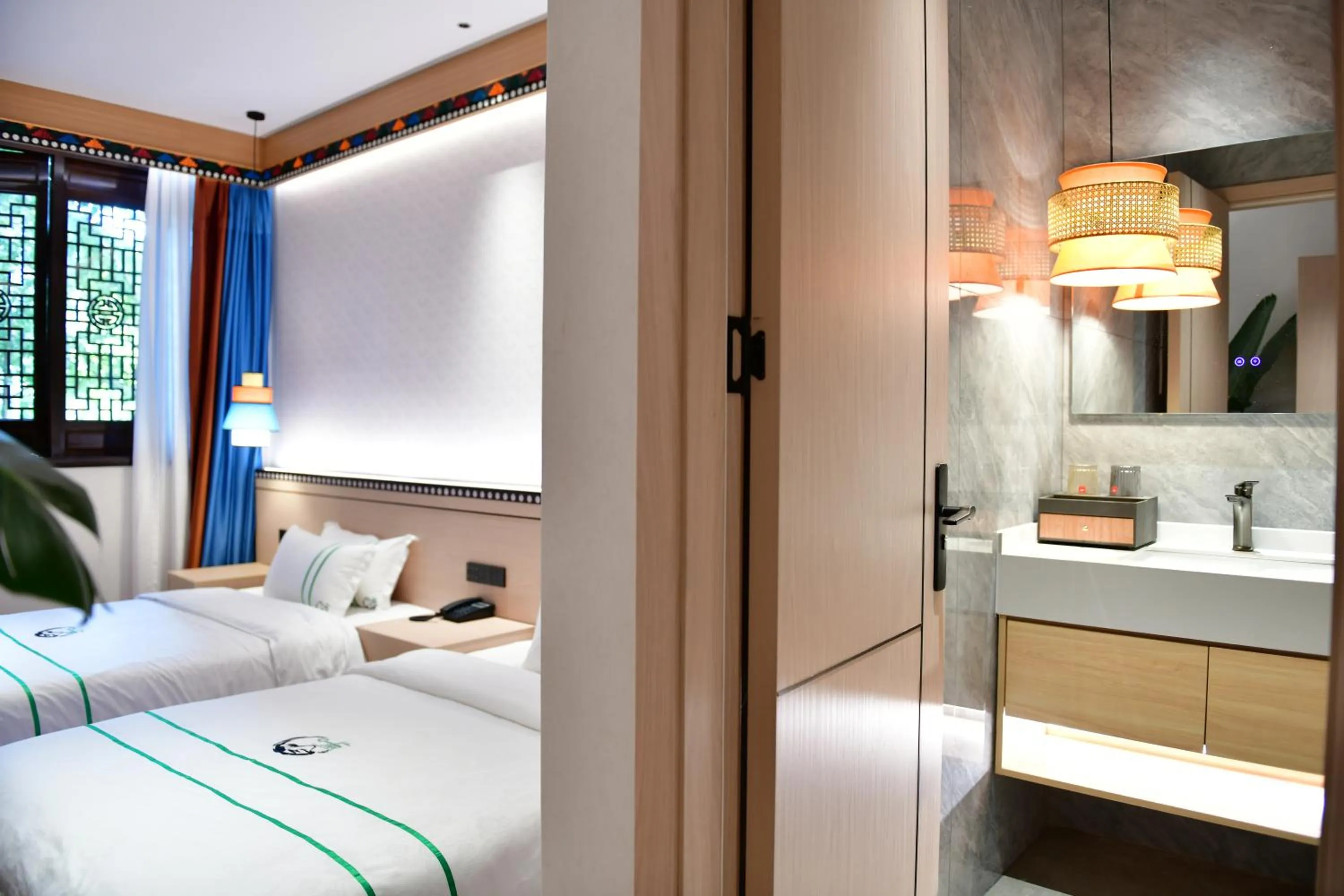 Photo of the whole room, Bed in Xishu Garden Inn - Travel Agency service - Car Rent service - English Speaking