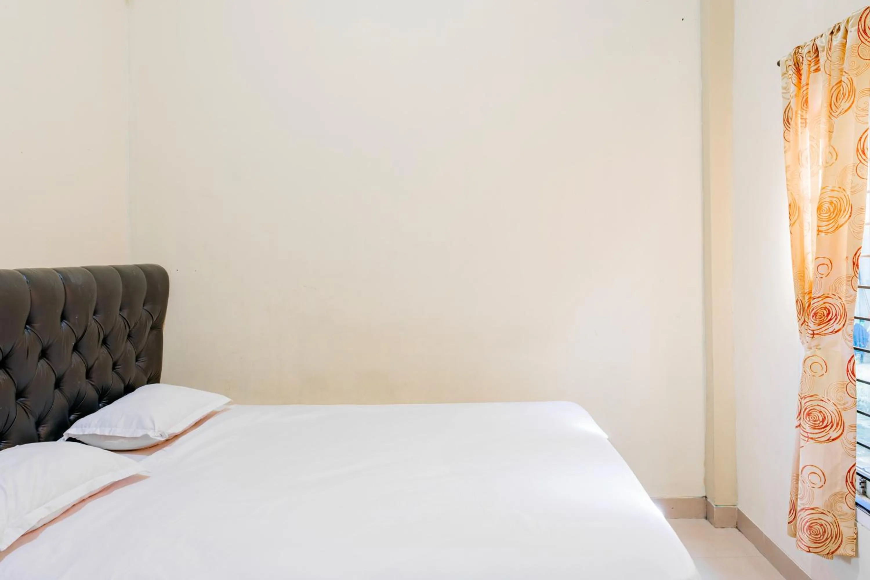 Bedroom in Hotel O Rinjani Guest House