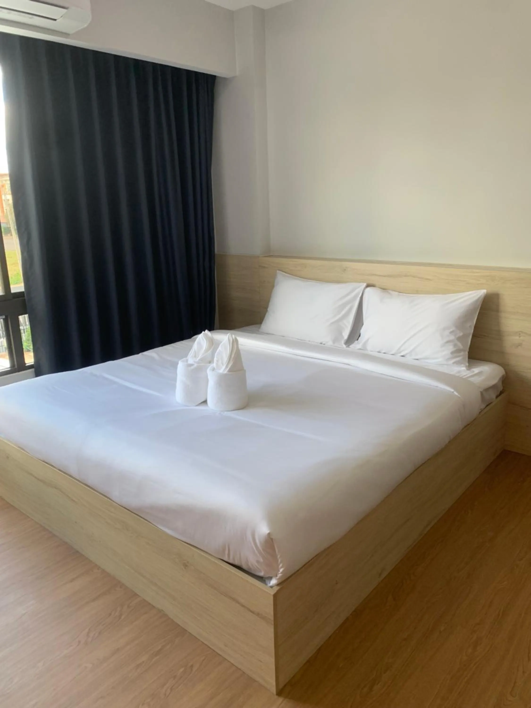 Bed in JIA HAUS Hotel Apartment