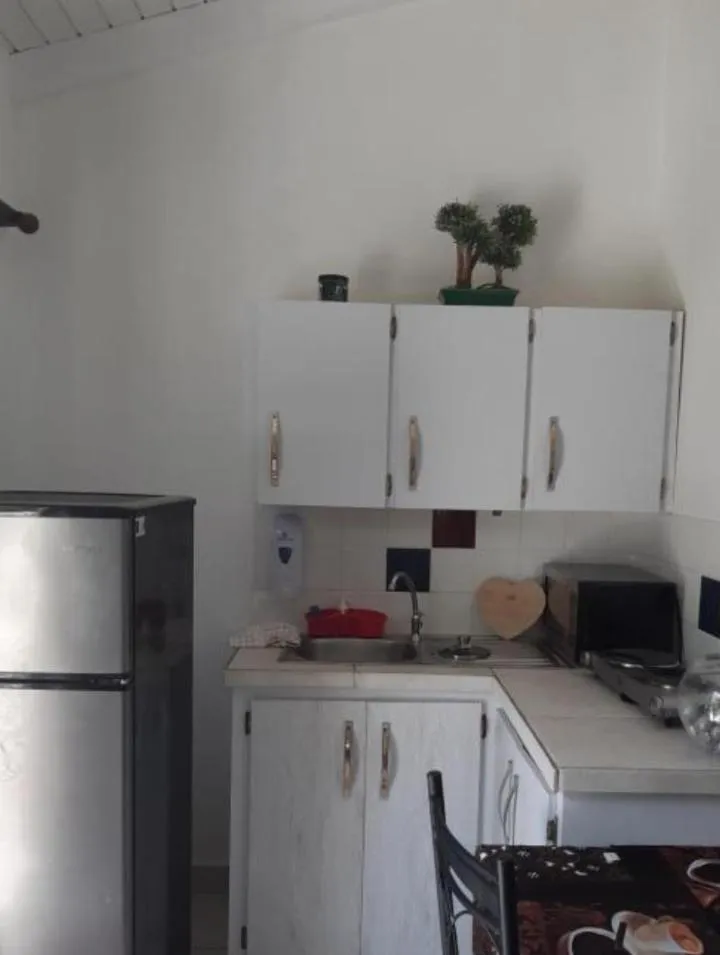 Kitchen or kitchenette in YOUR FIRST DAY Hotel on Aruba