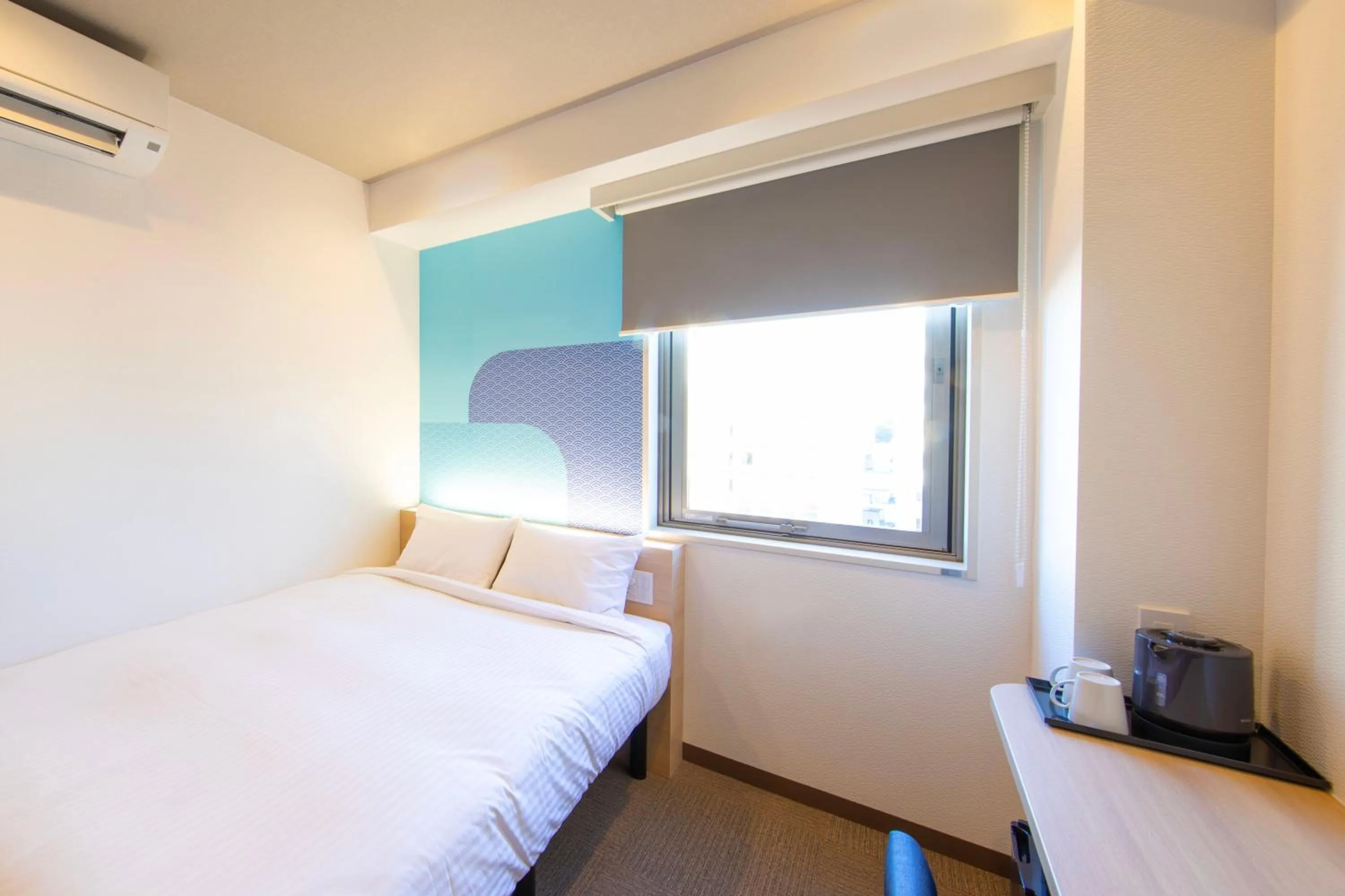 Bed in Hop Inn Tokyo Iidabashi