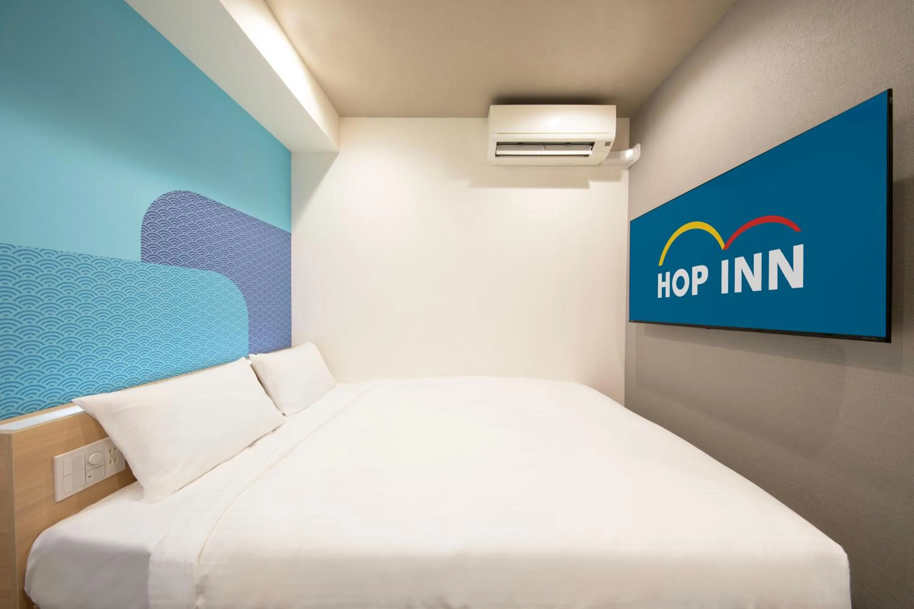 Bed in Hop Inn Tokyo Iidabashi