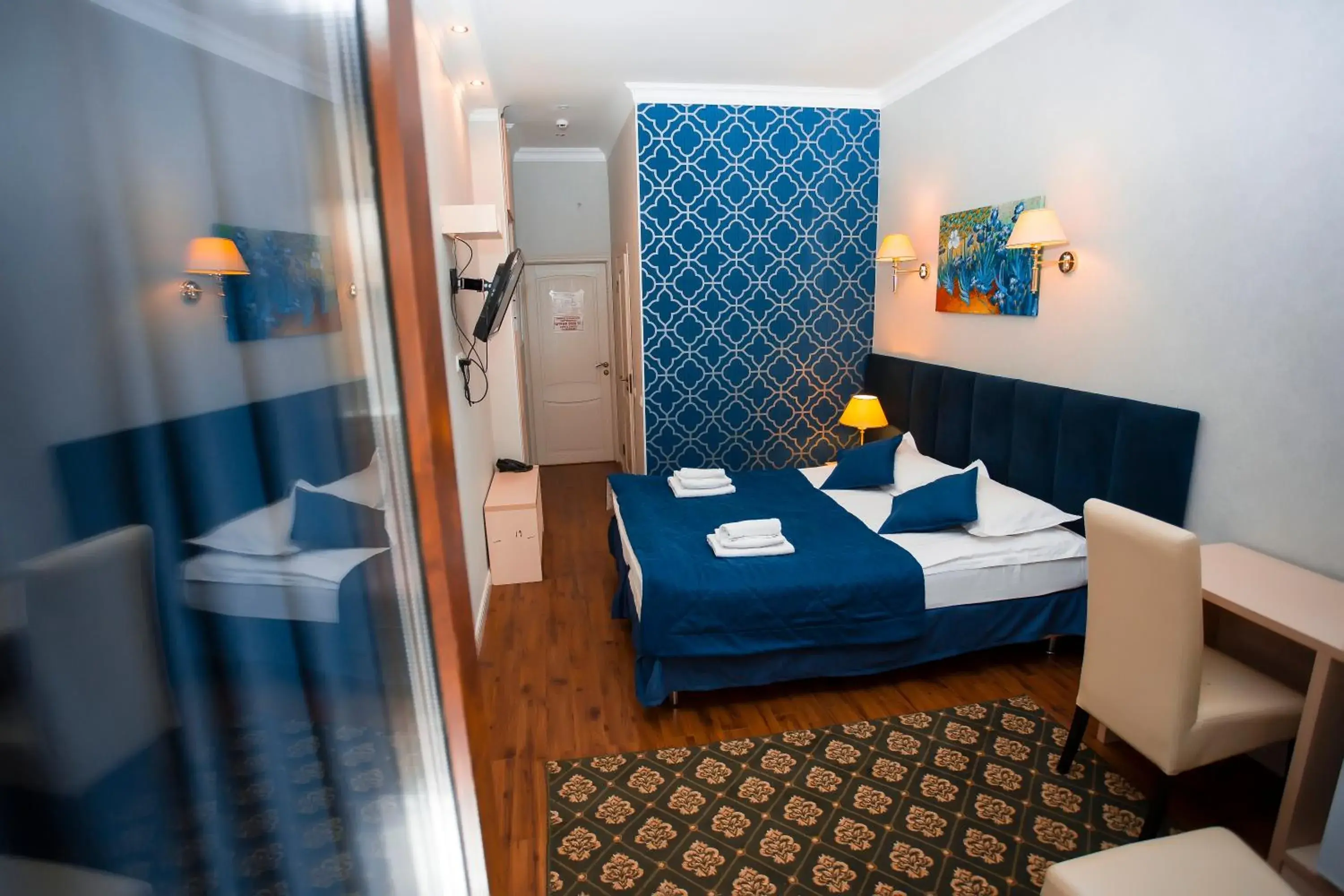 Bed in Aruna Hotel Bed in Aruna Hotel