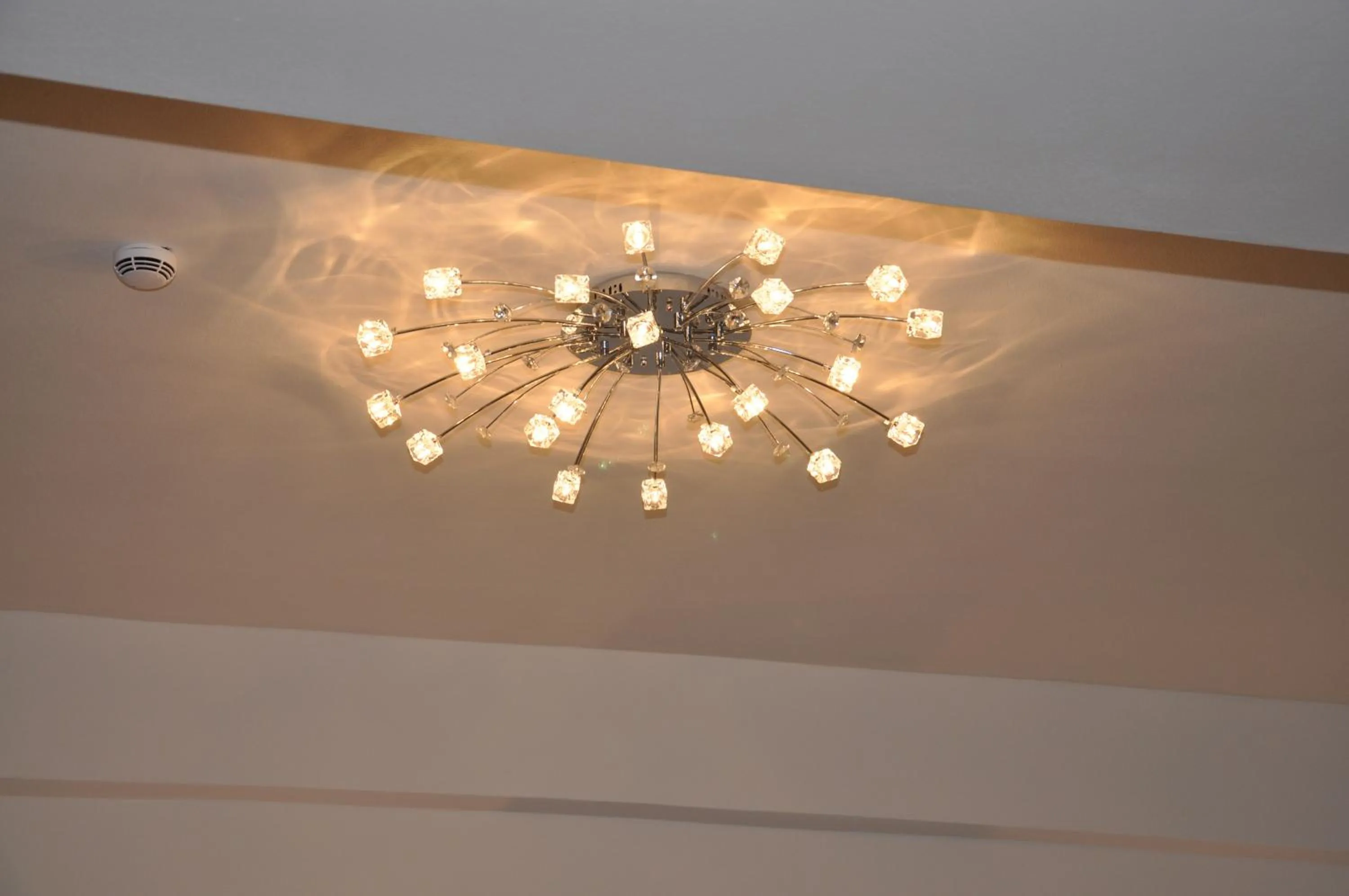 Bedroom in Grand White City Hotel