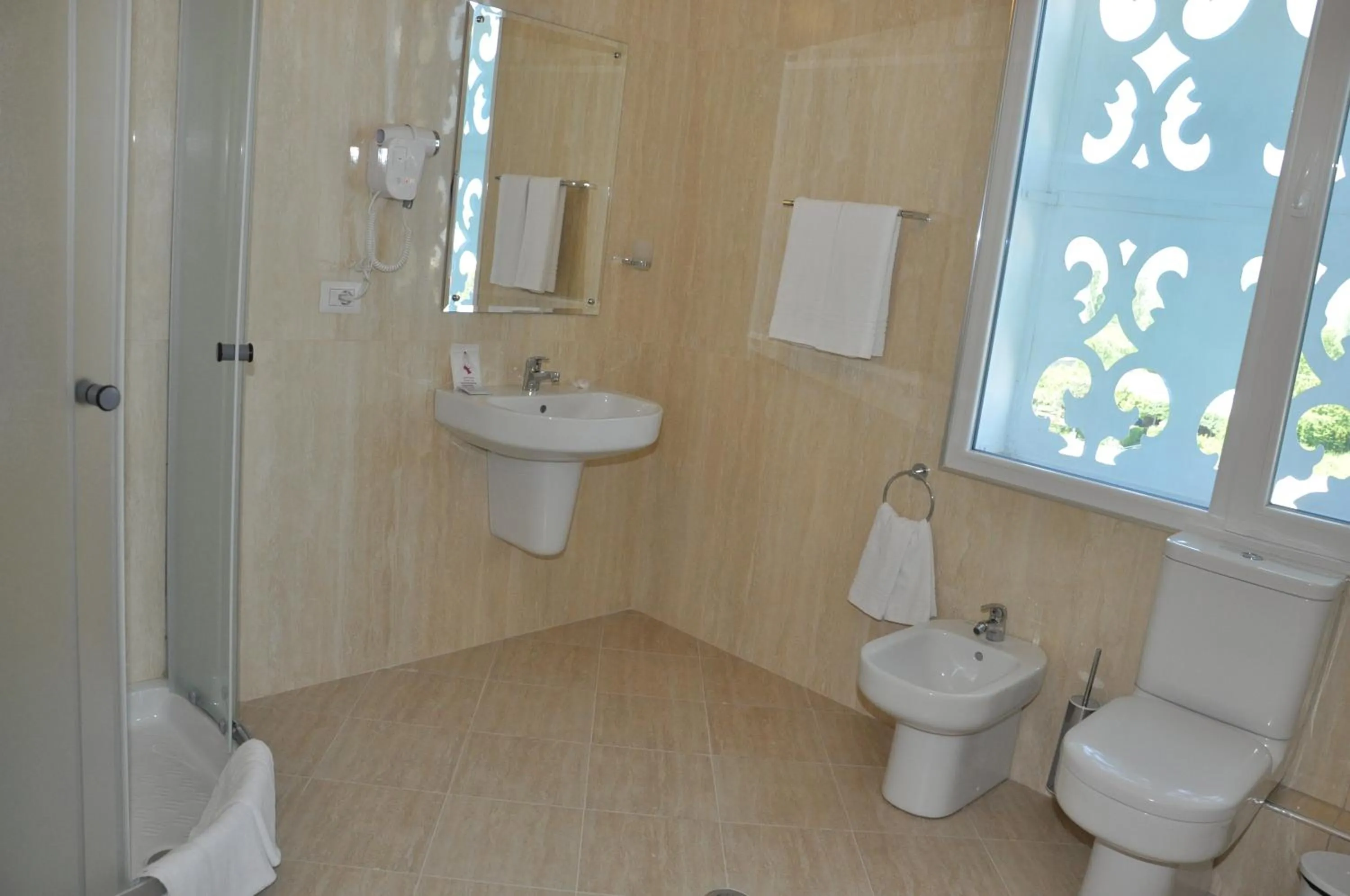 Shower in Grand White City Hotel