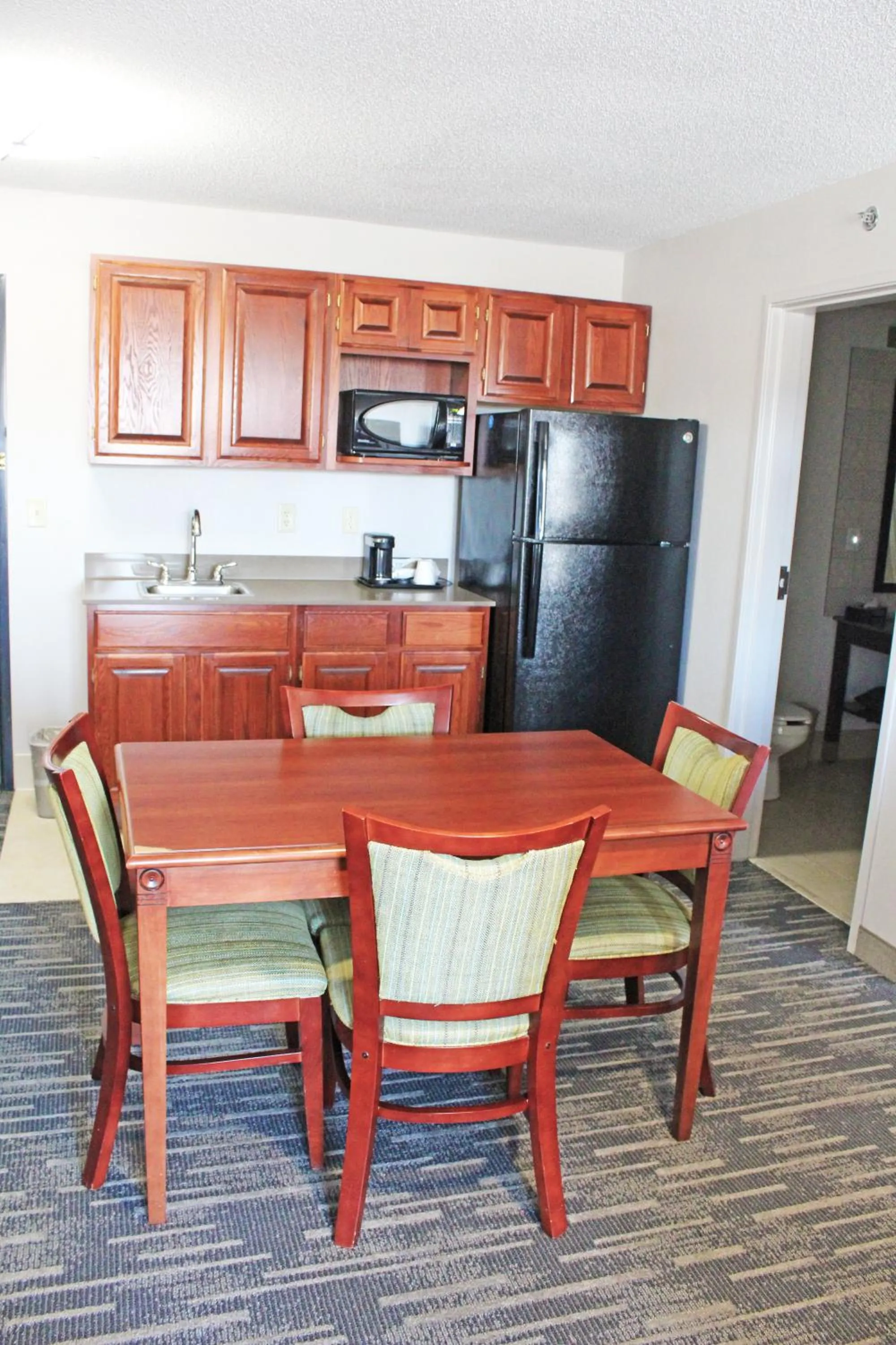 Kitchen or kitchenette in Independence Stay Hotel & Suites