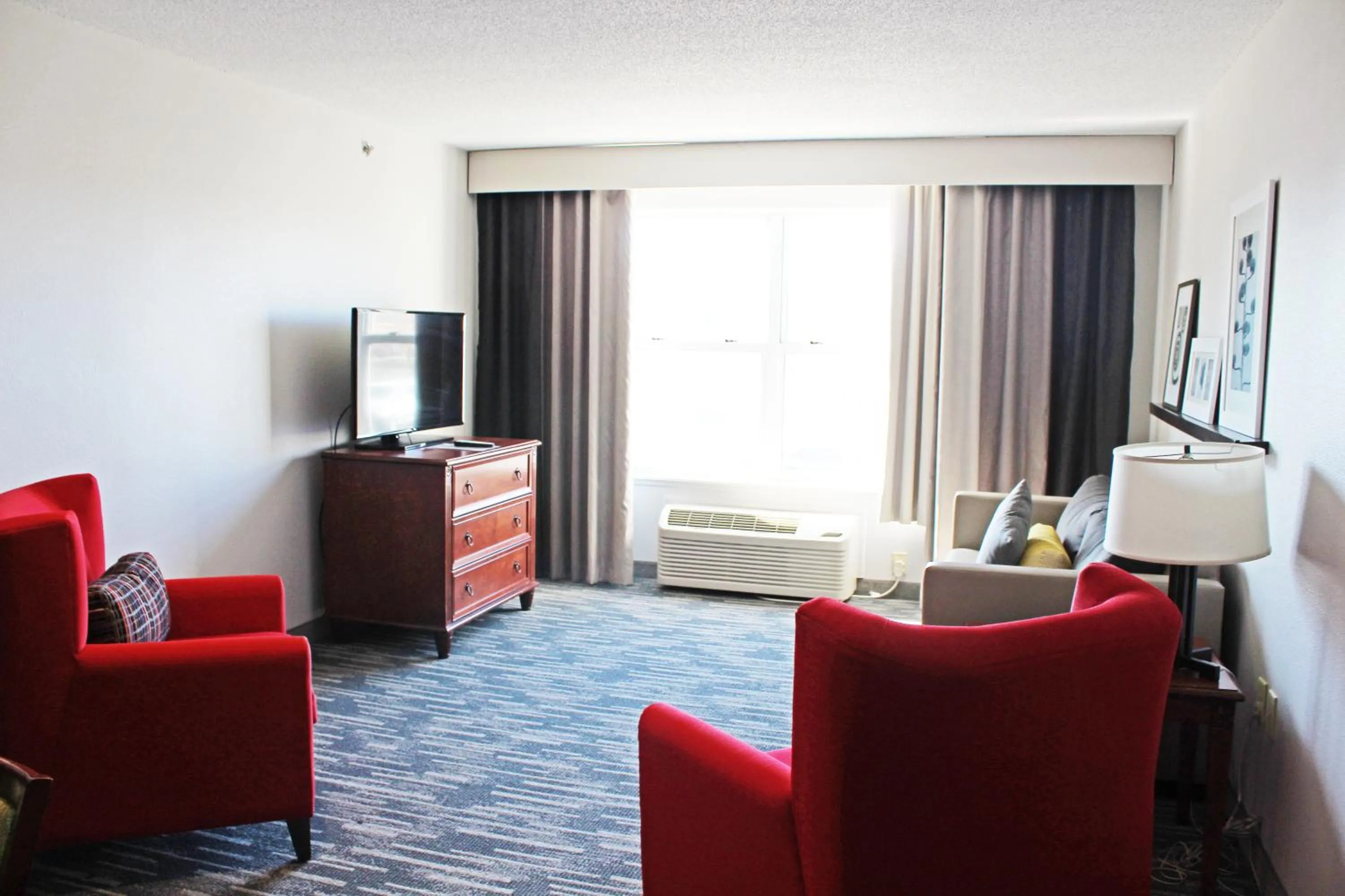 Bed in Independence Stay Hotel & Suites