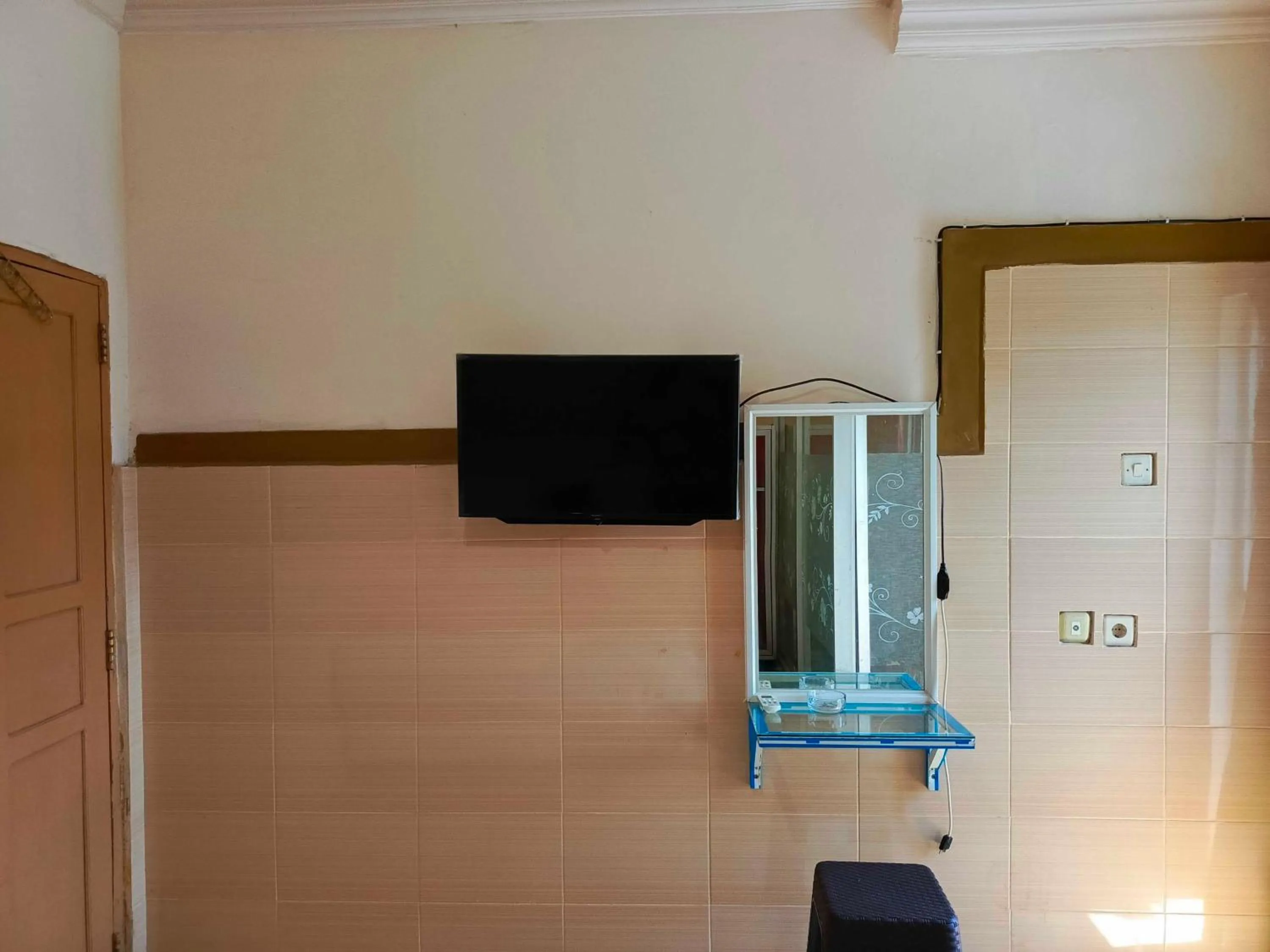 Bedroom in Hotel O Wisma Syariah Lahundape