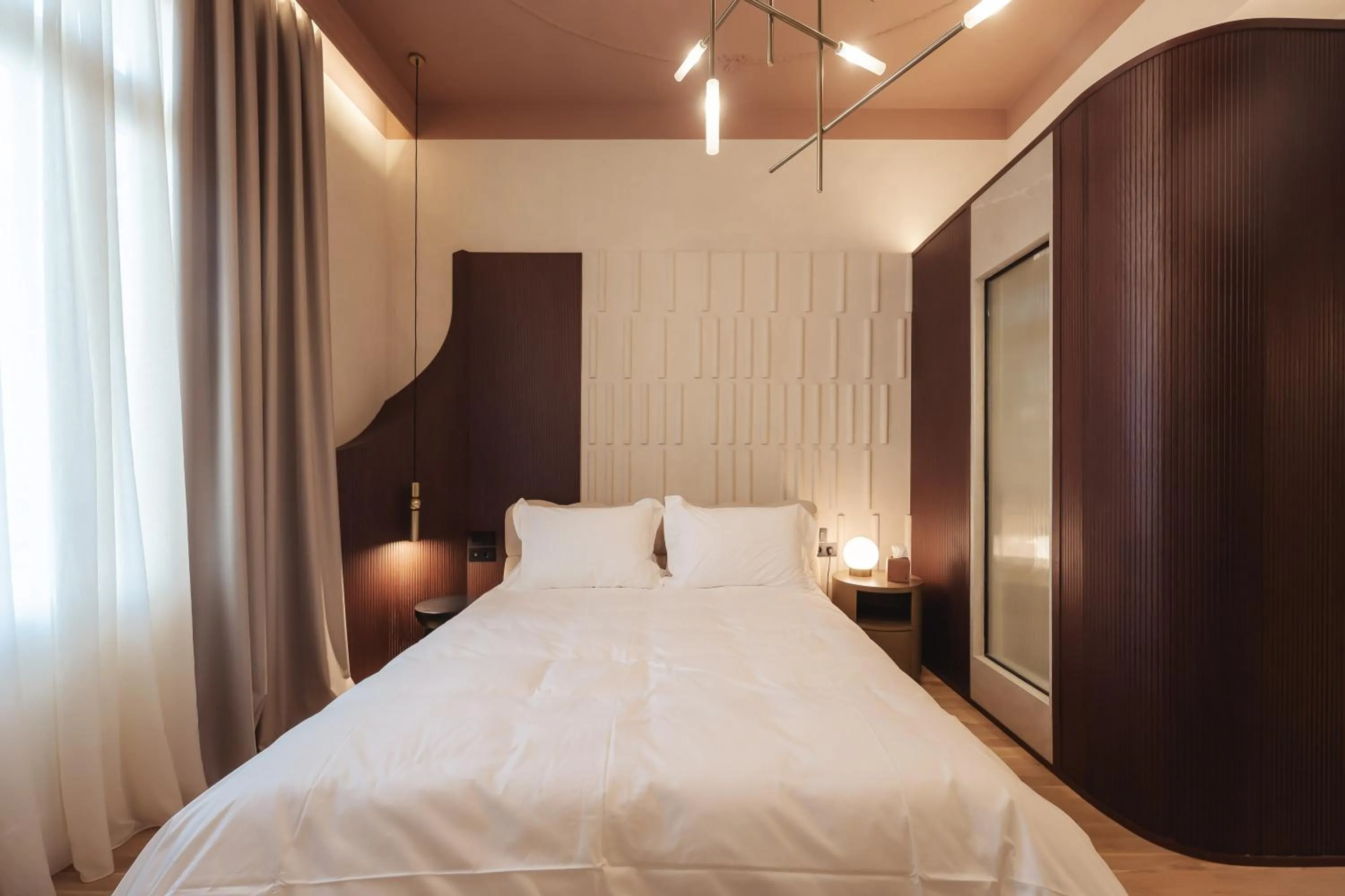 Bed in Zenith Premium Suites