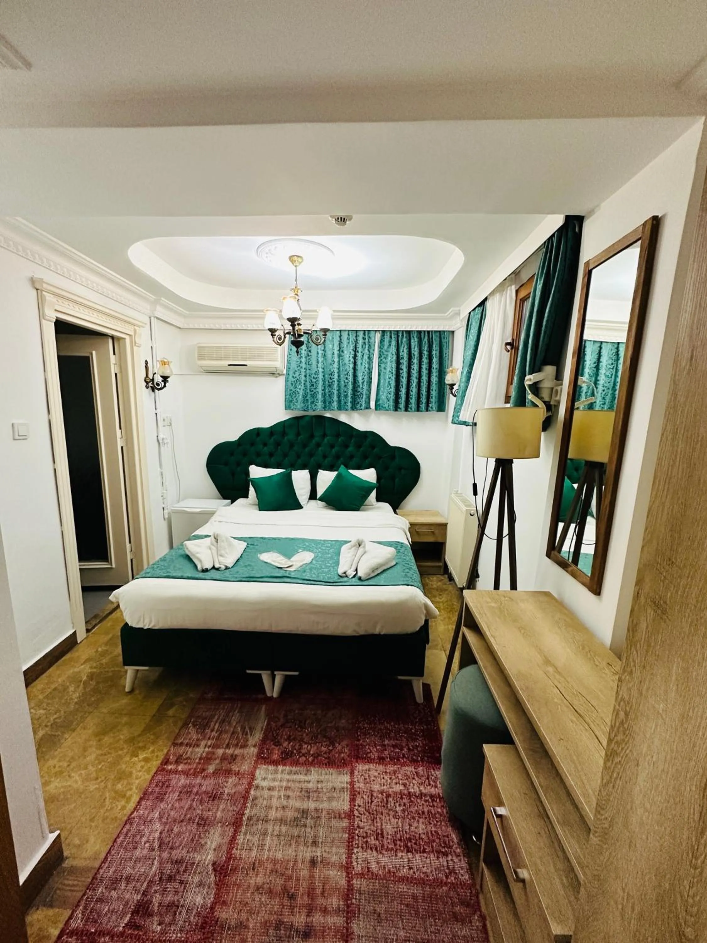 Bed in La Petite Maison Hotel