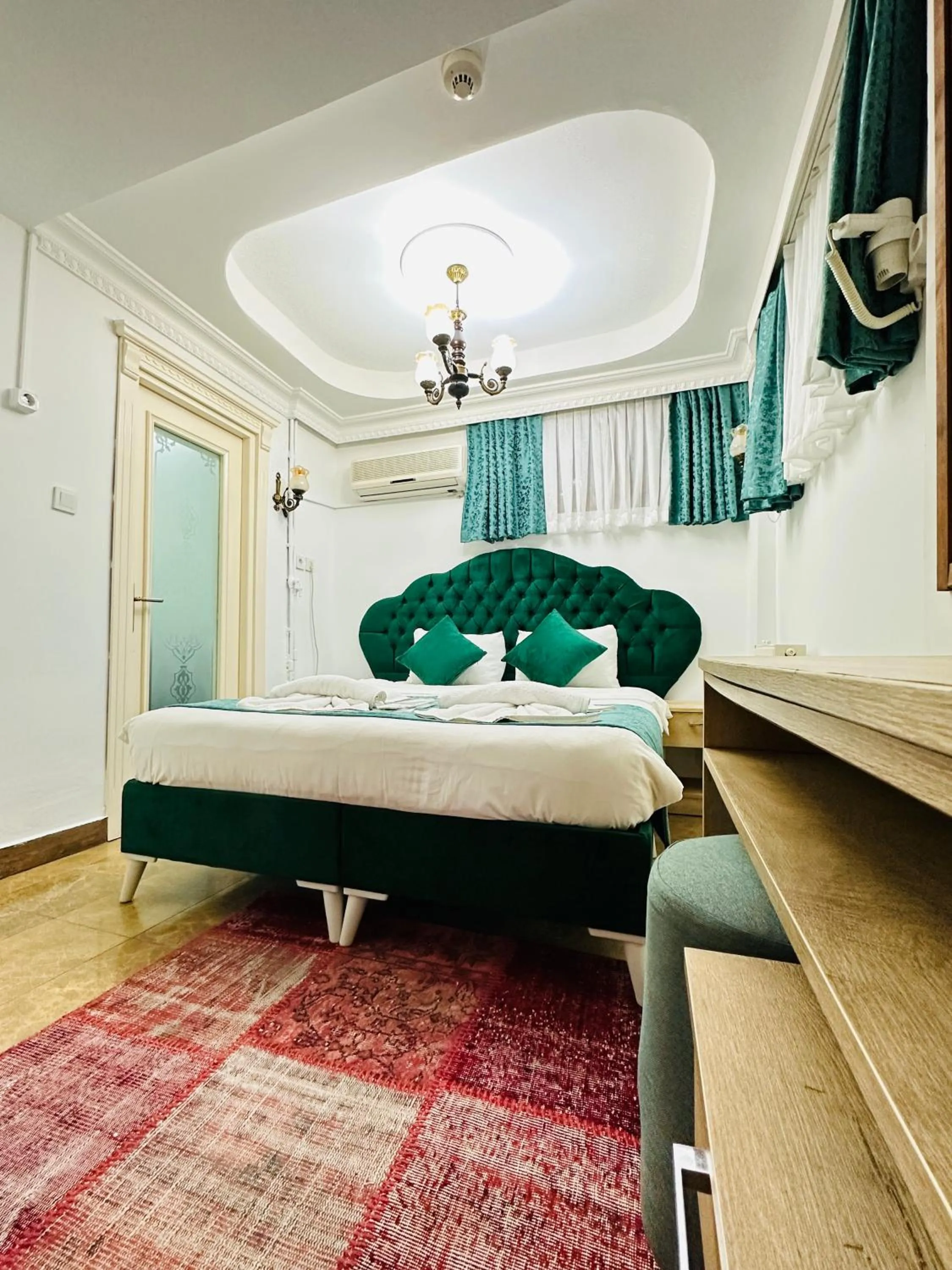 Bed in La Petite Maison Hotel