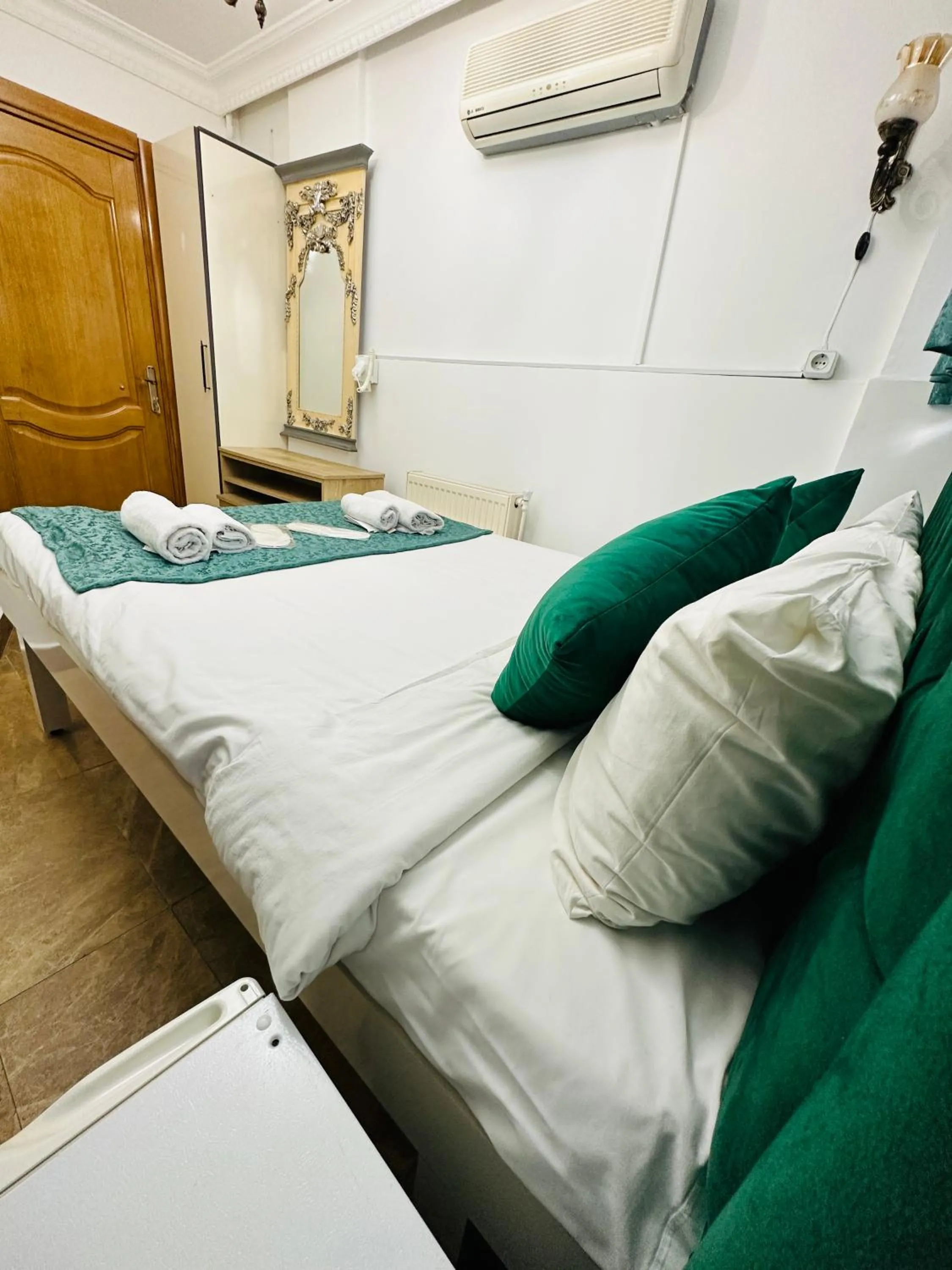 Bed in La Petite Maison Hotel