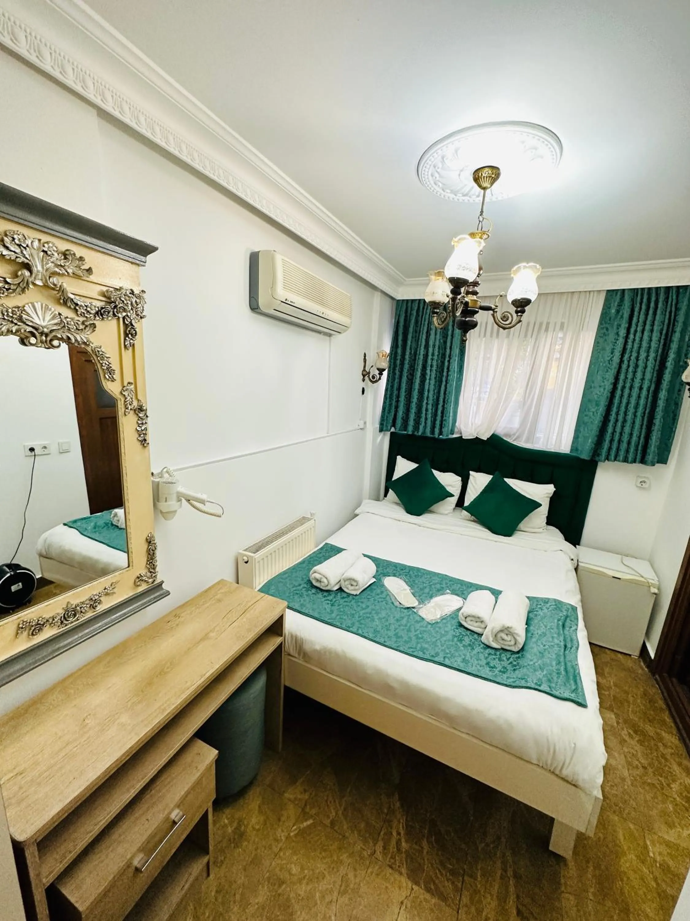 Bed in La Petite Maison Hotel