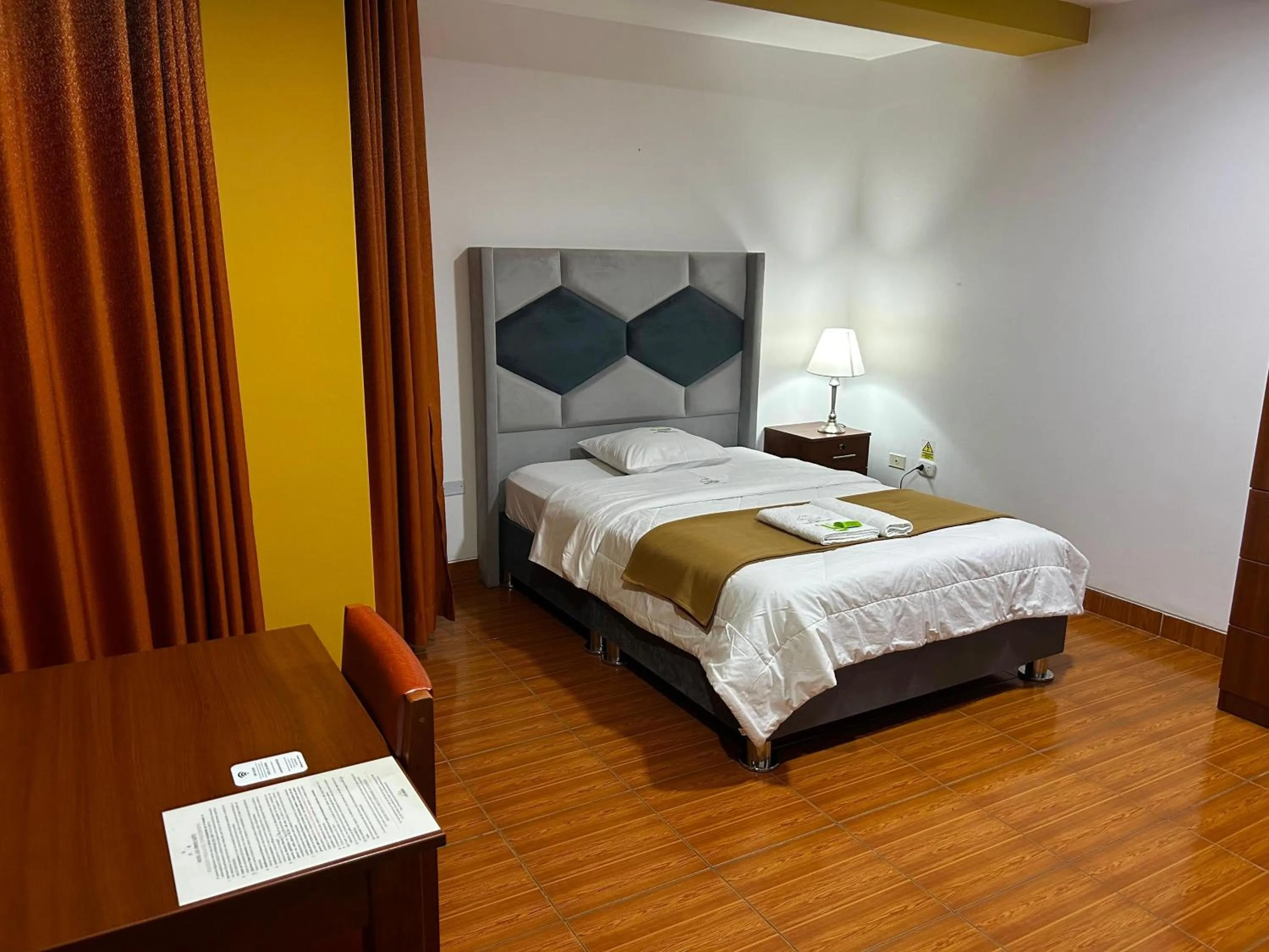 Bed in HOTEL LOS ANDES SUITE