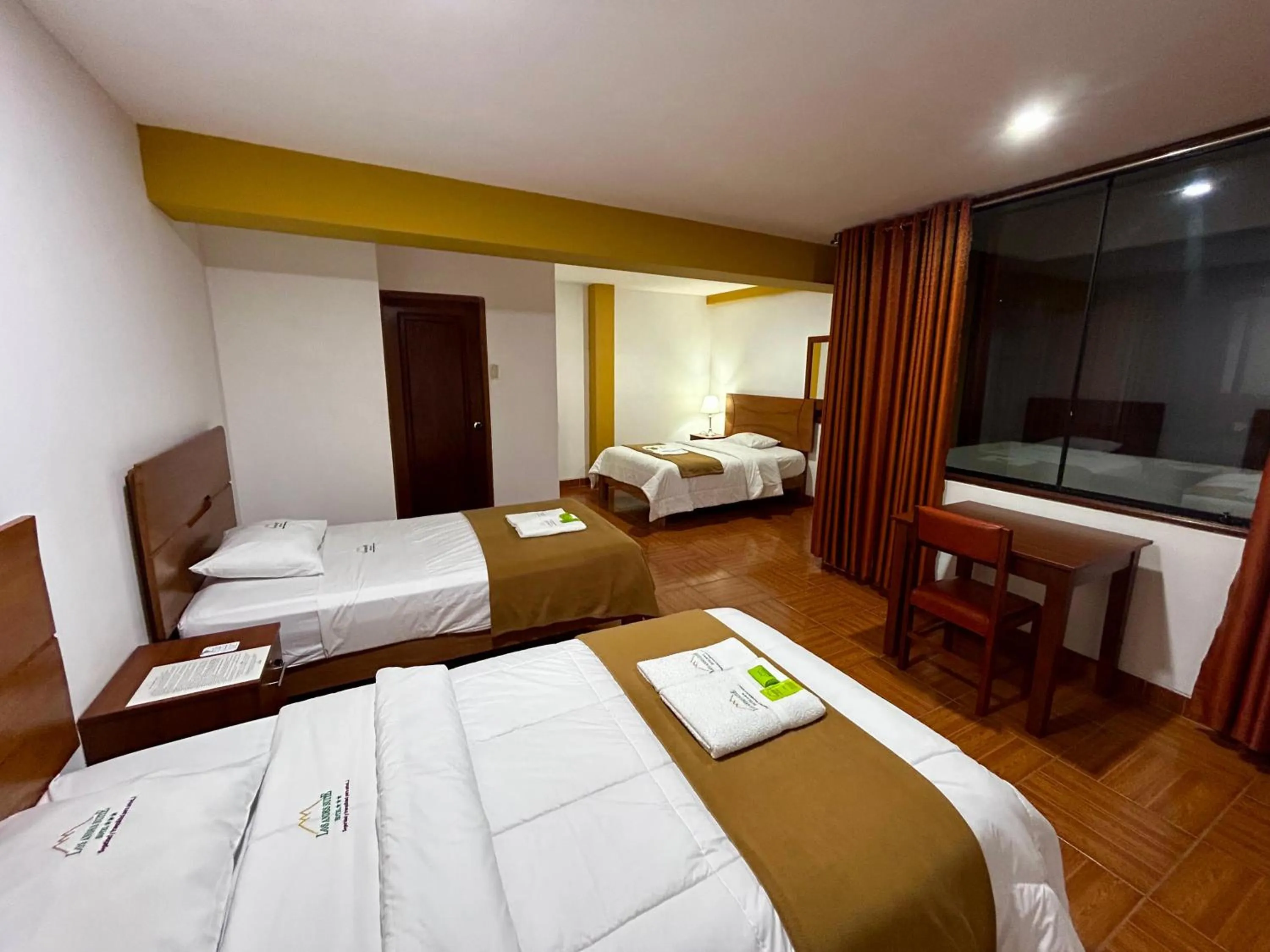 Bed in HOTEL LOS ANDES SUITE