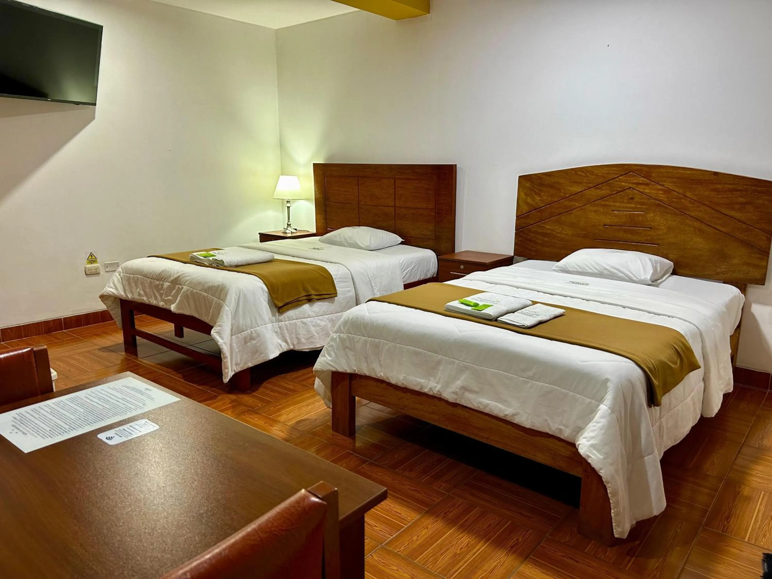 Bed in HOTEL LOS ANDES SUITE