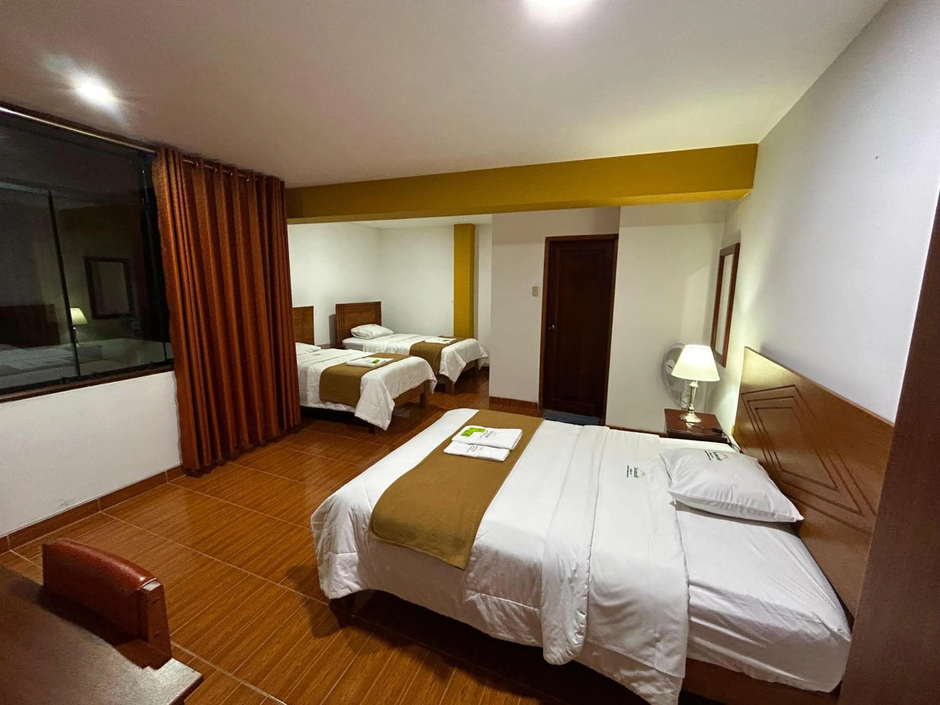 Bed in HOTEL LOS ANDES SUITE