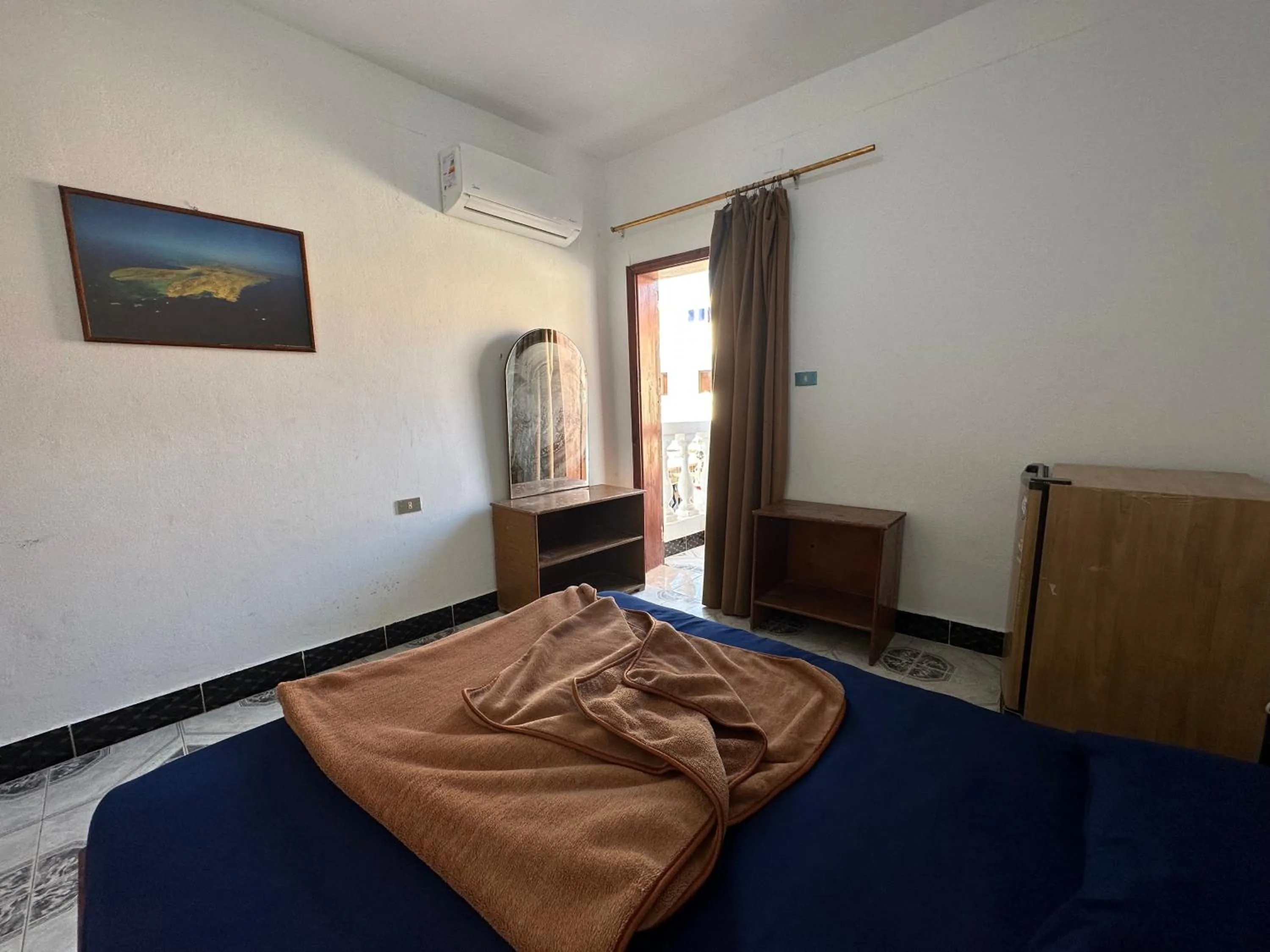 Bed in Seven Heaven Hotel And Diving Center