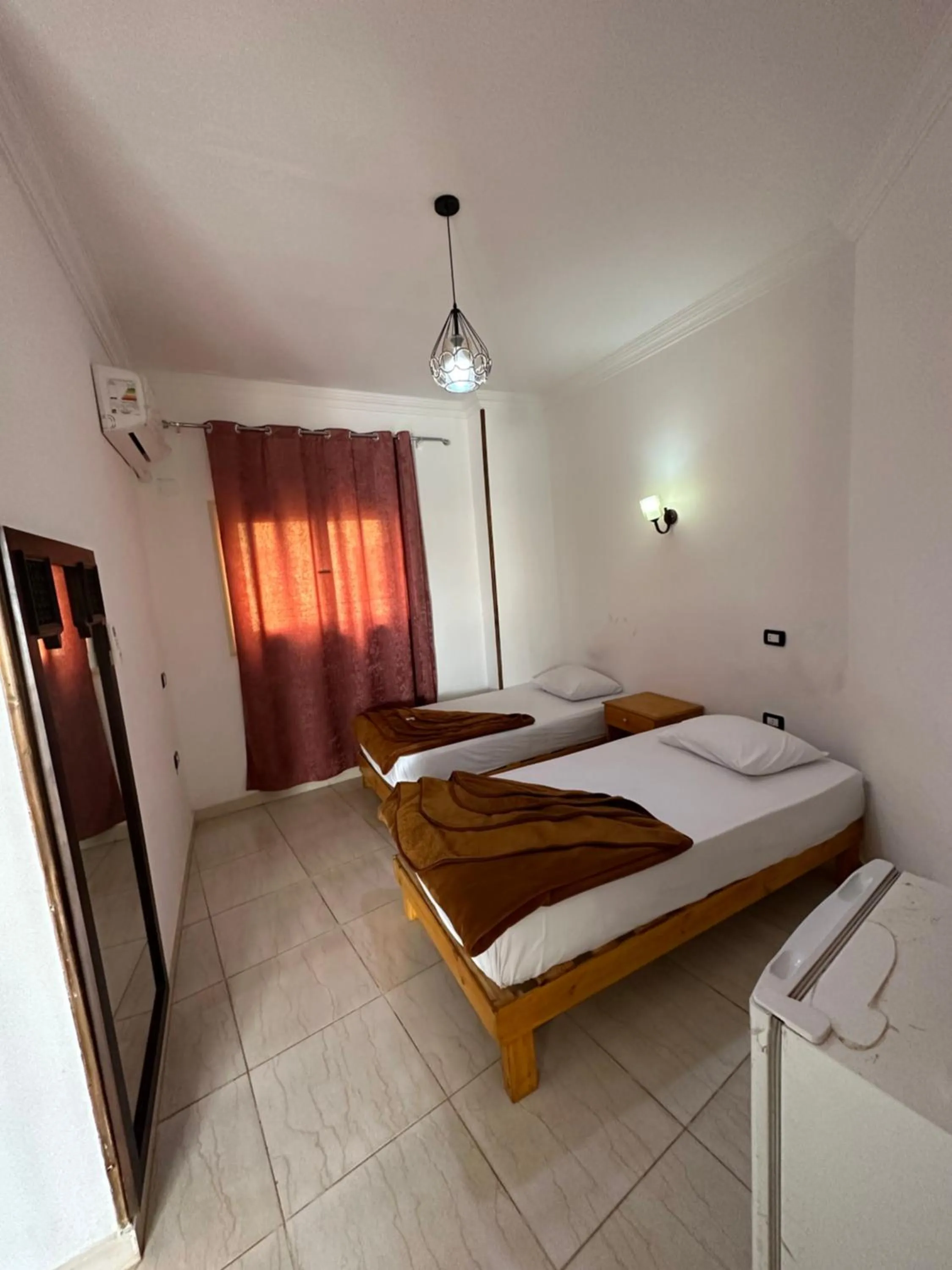 Bed in Seven Heaven Hotel And Diving Center