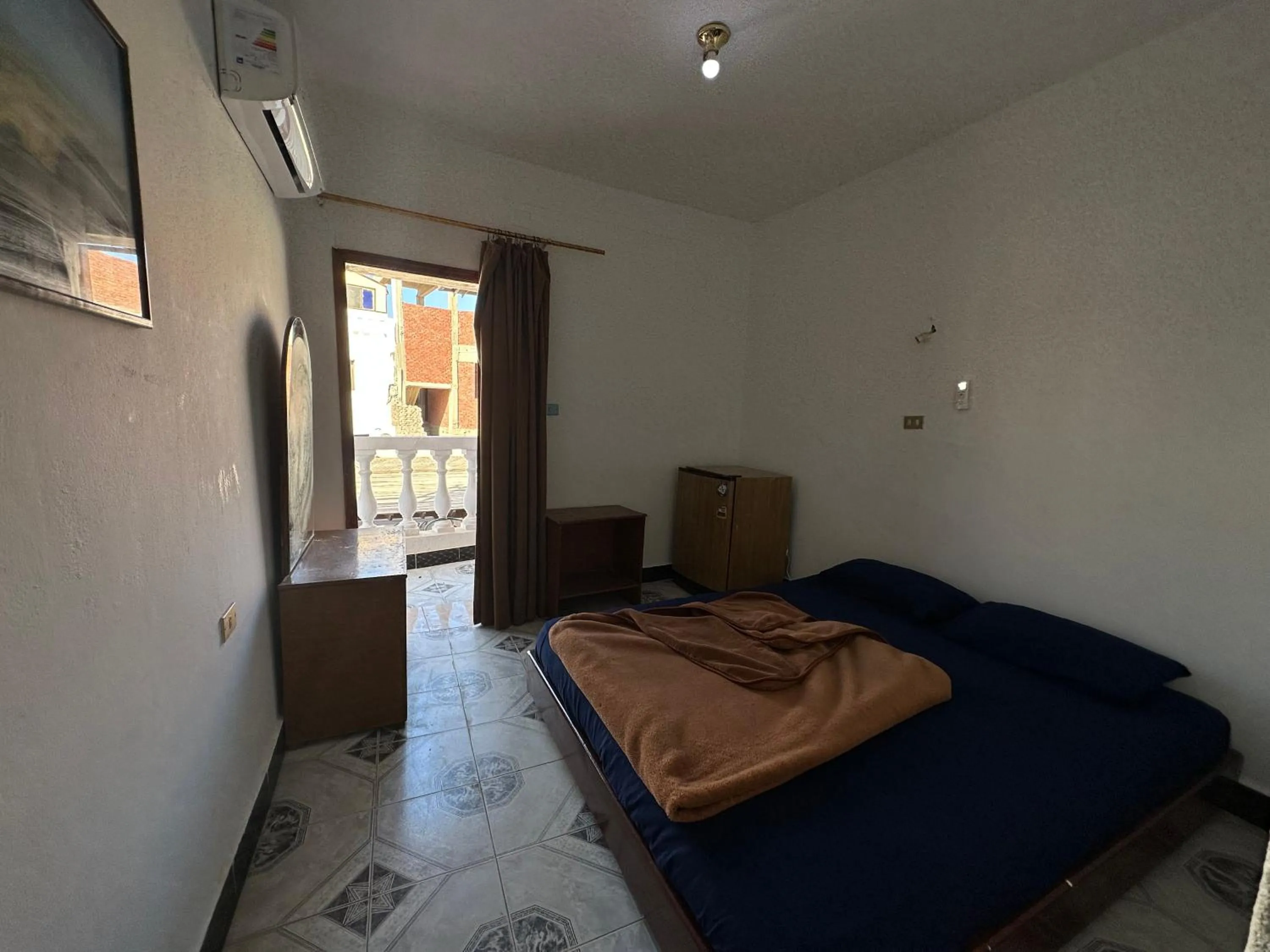 Bed in Seven Heaven Hotel And Diving Center