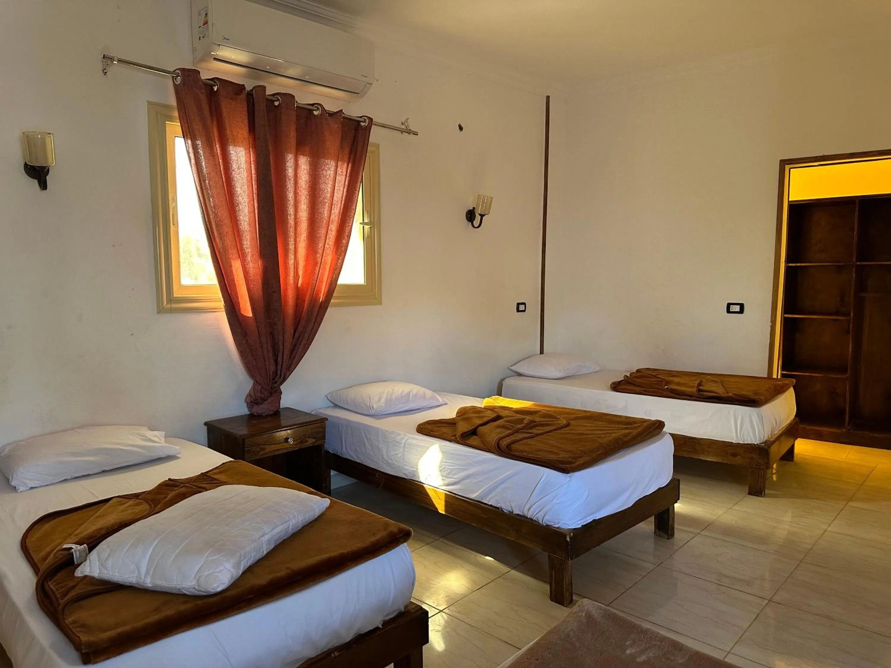 Bed in Seven Heaven Hotel And Diving Center