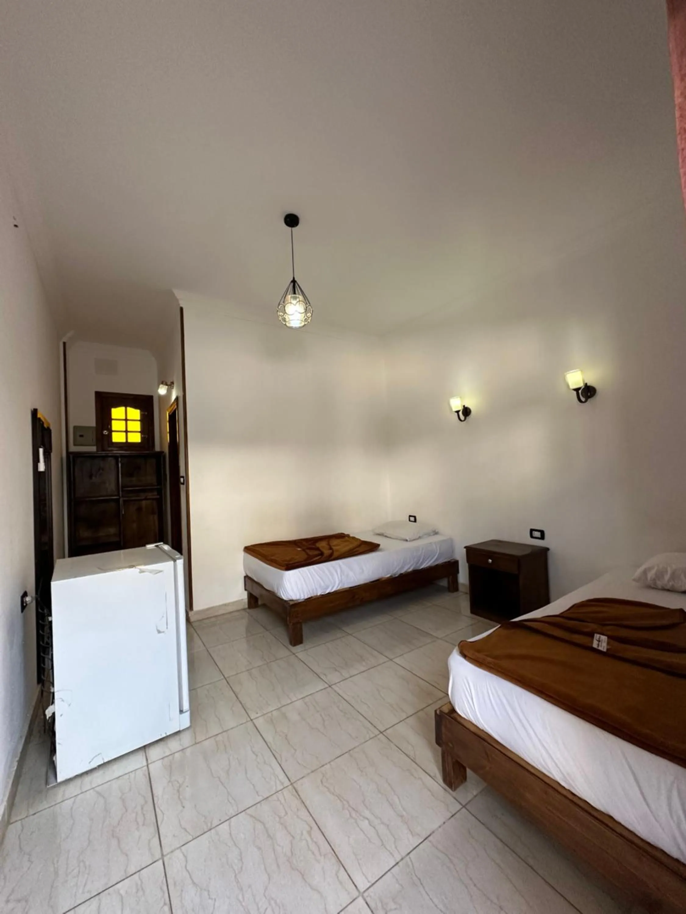 Bed in Seven Heaven Hotel And Diving Center