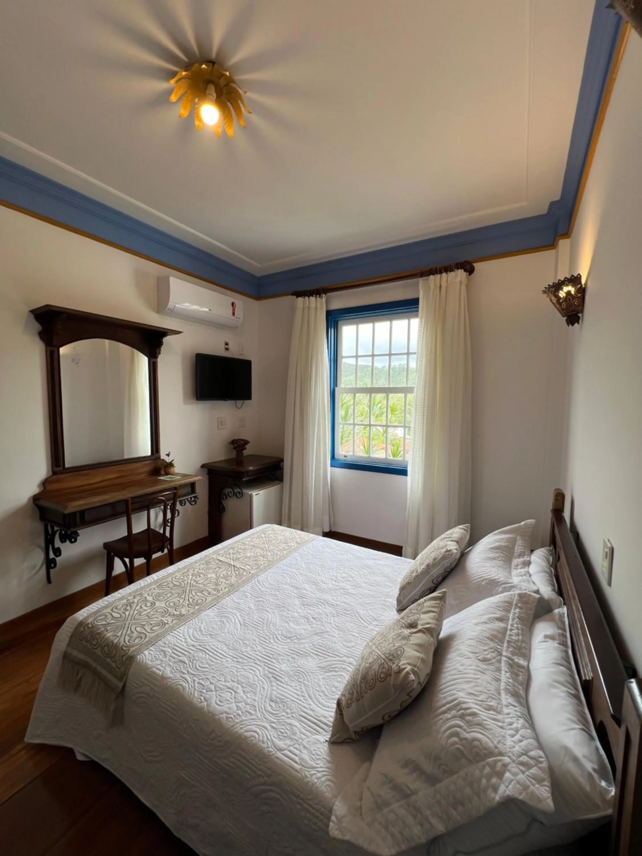 Bed in Pousada Sinhá Olímpia