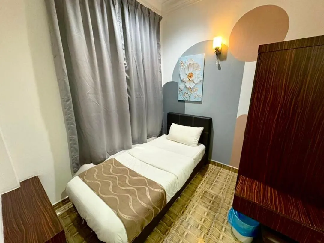 Bed in DAILY INN HOTEL