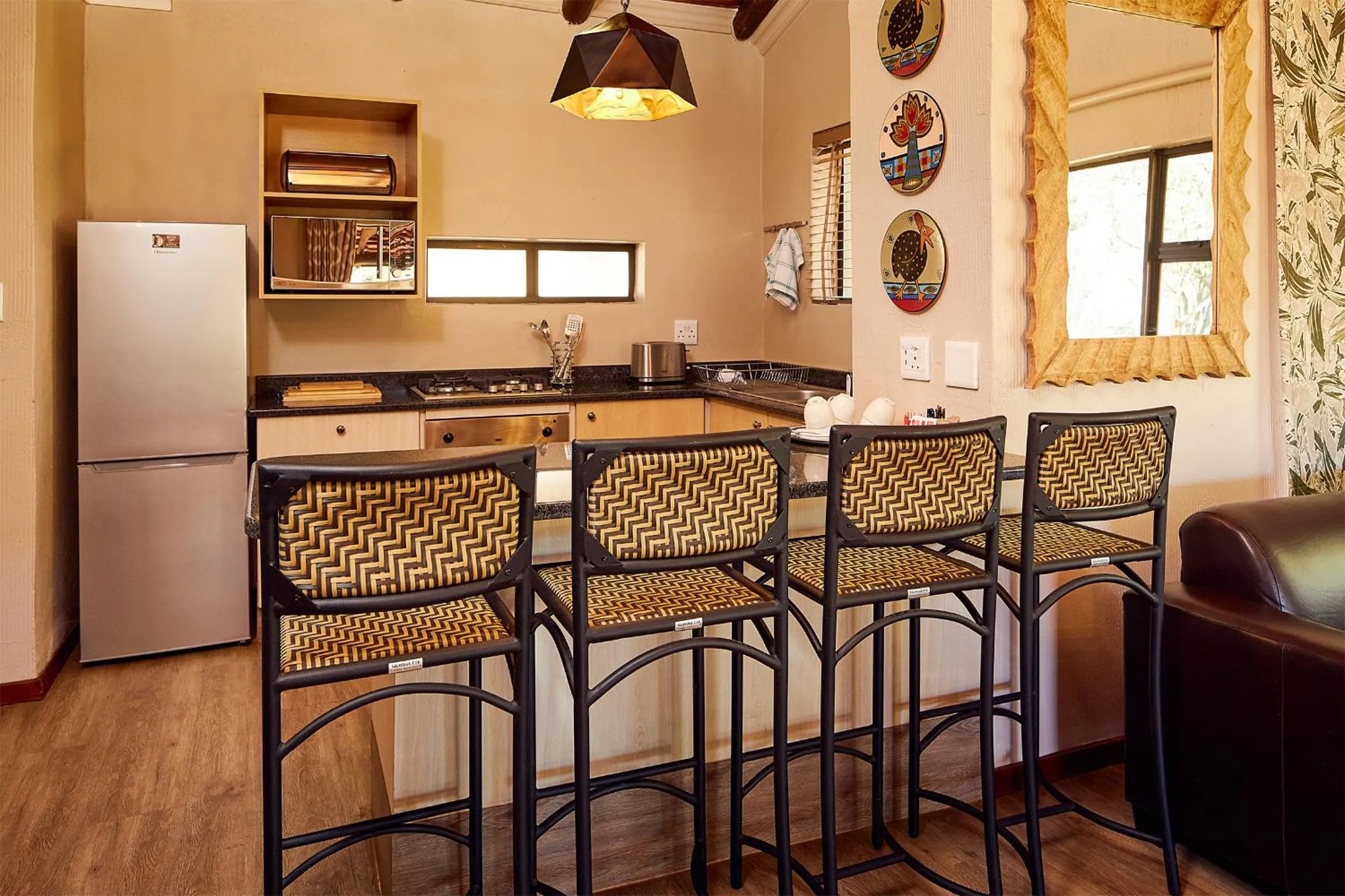 Kitchen or kitchenette in First Group Qwantani