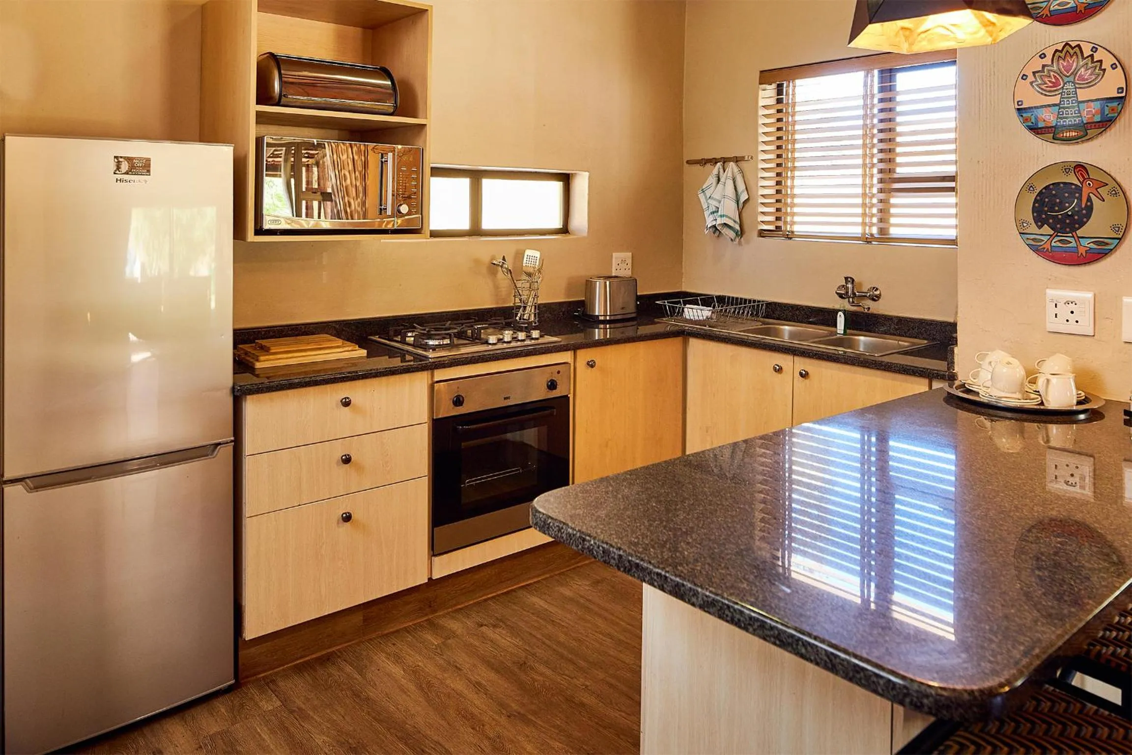 Kitchen or kitchenette in First Group Qwantani