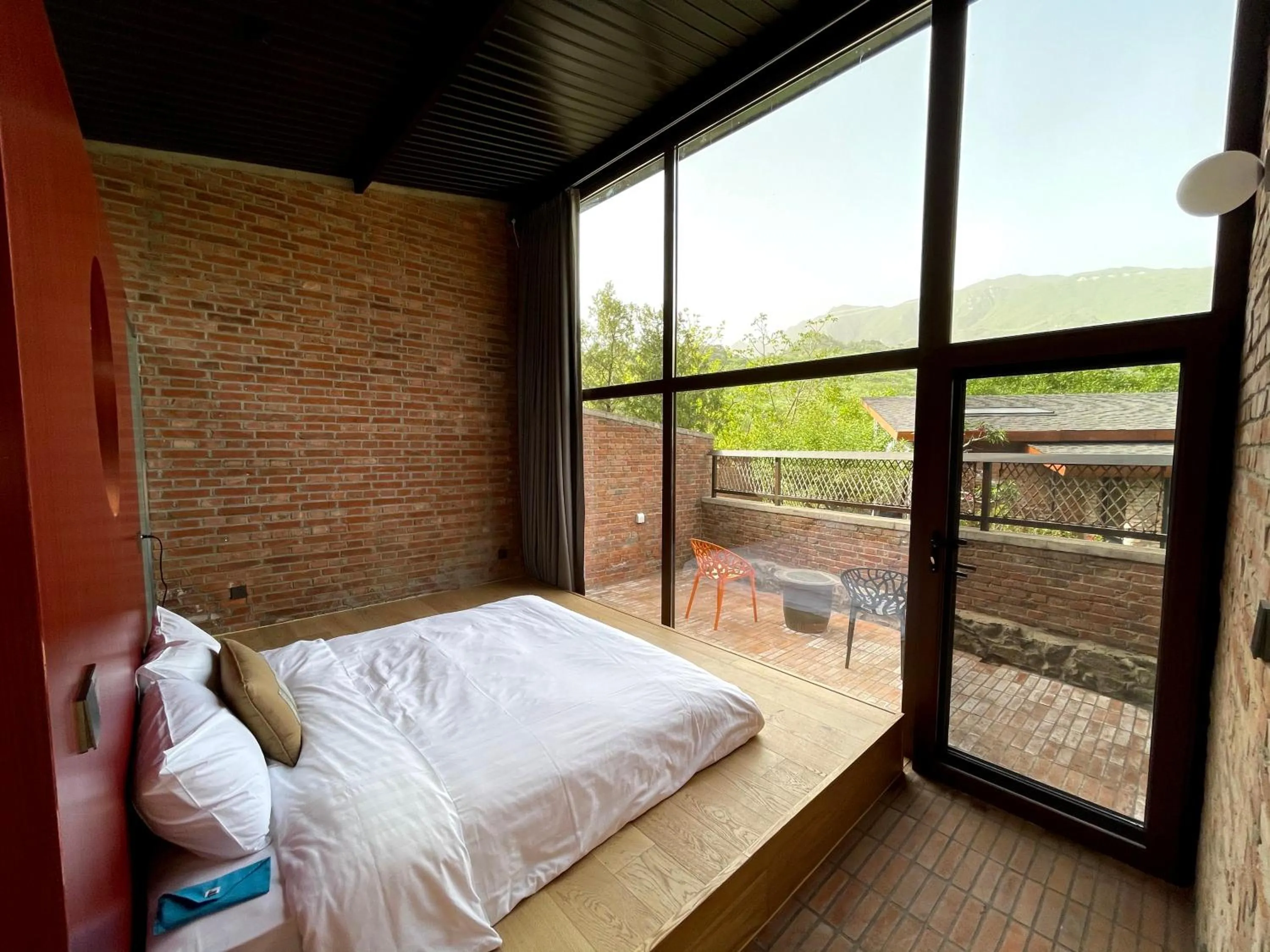 Photo of the whole room, Bed in Brickyard Retreat at Mutianyu Great Wall Adjoin to Mutianyu Great Wall - Room with the View of Great Wall - Jacuzzi with the View of Great Wall - Vehicle Shuttle Service - International Catering - SPA& Nail Beauty Facilities