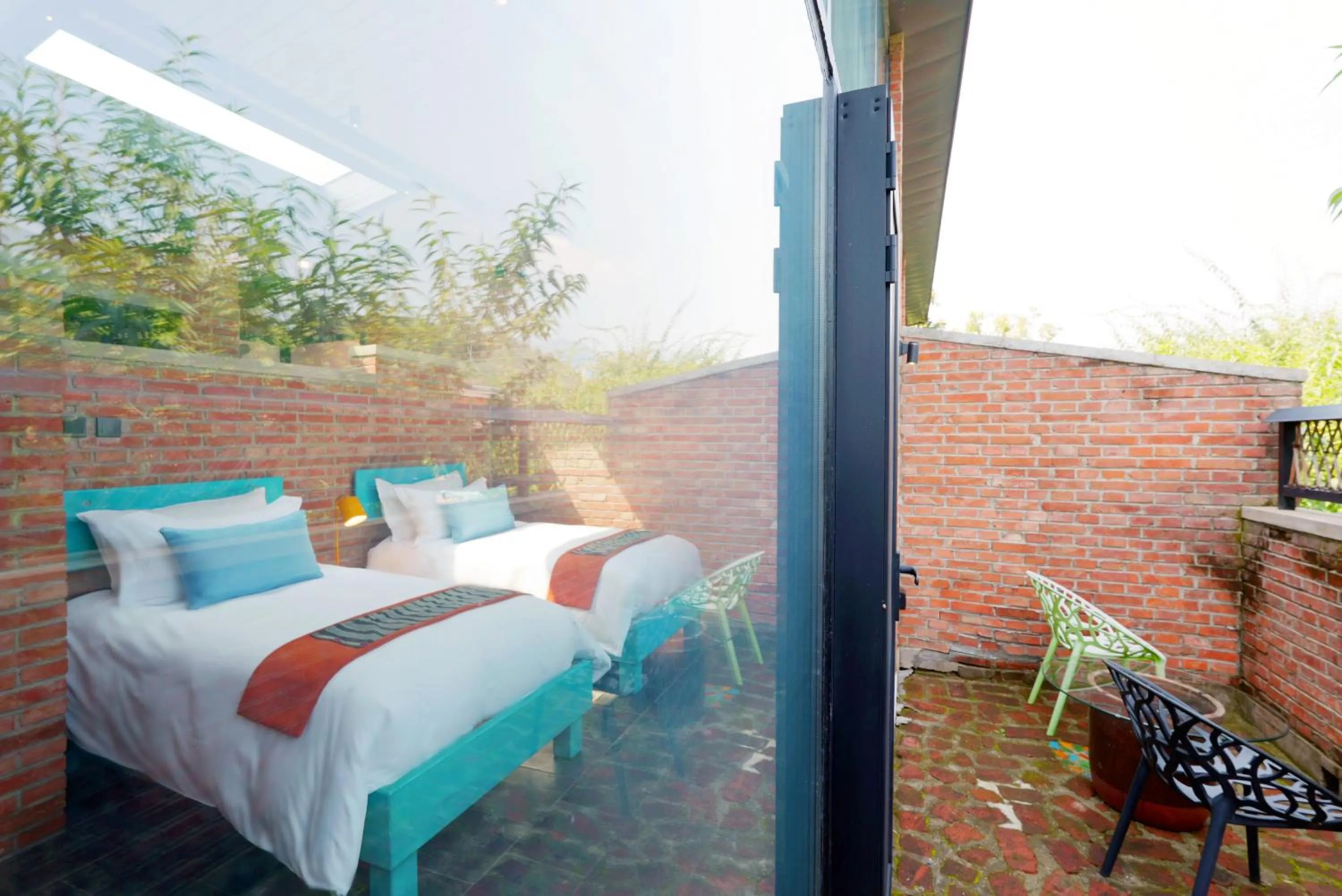 Bed in Brickyard Retreat at Mutianyu Great Wall Adjoin to Mutianyu Great Wall - Room with the View of Great Wall - Jacuzzi with the View of Great Wall - Vehicle Shuttle Service - International Catering - SPA& Nail Beauty Facilities