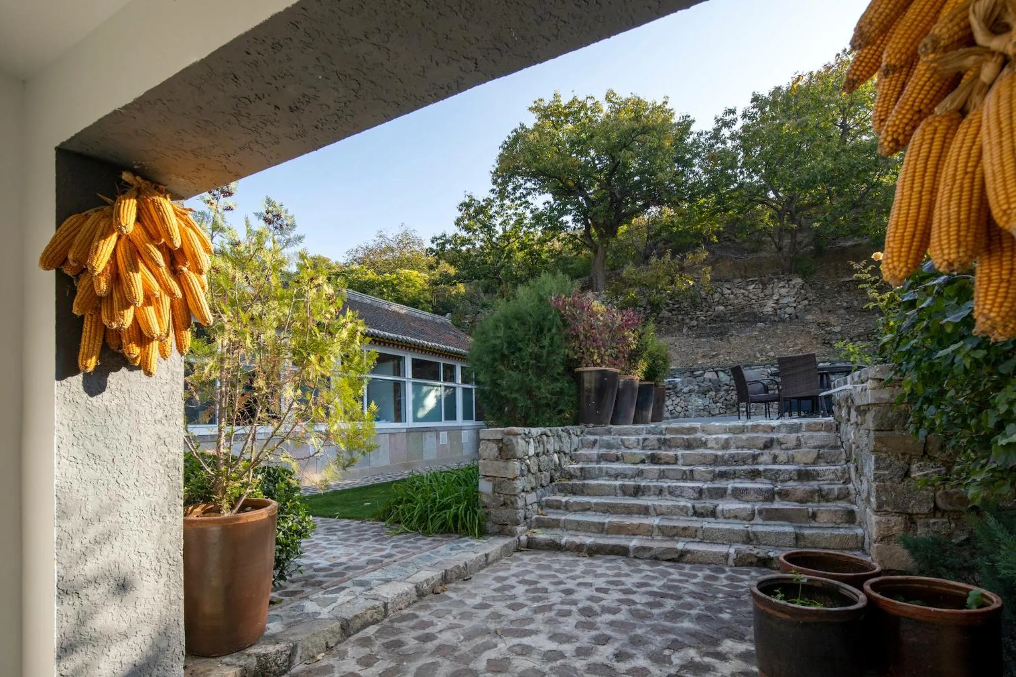 Garden view in Brickyard Retreat at Mutianyu Great Wall Adjoin to Mutianyu Great Wall - Room with the View of Great Wall - Jacuzzi with the View of Great Wall - Vehicle Shuttle Service - International Catering - SPA& Nail Beauty Facilities