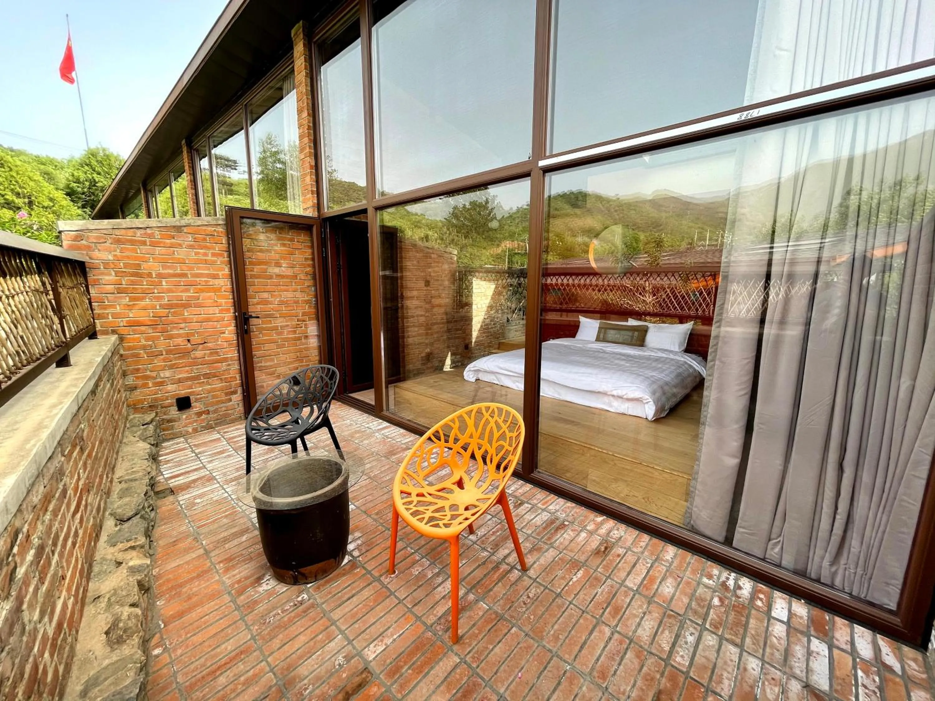 Balcony/Terrace in Brickyard Retreat at Mutianyu Great Wall Adjoin to Mutianyu Great Wall - Room with the View of Great Wall - Jacuzzi with the View of Great Wall - Vehicle Shuttle Service - International Catering - SPA& Nail Beauty Facilities