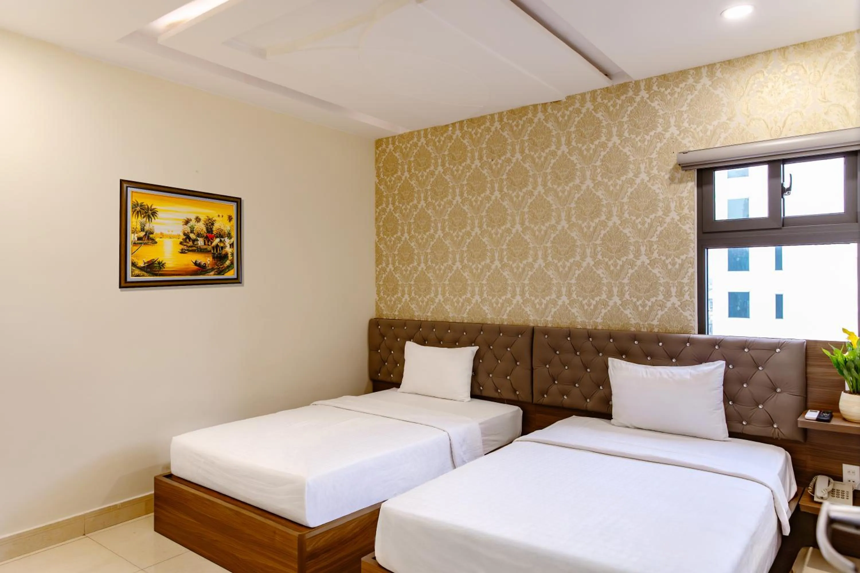 Bed in Boss Palace Hotel