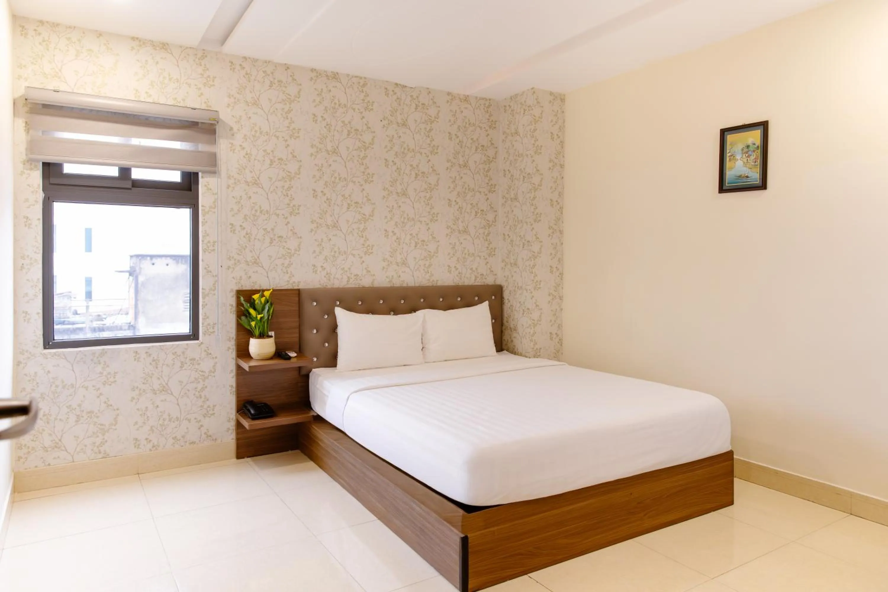 Bed in Boss Palace Hotel