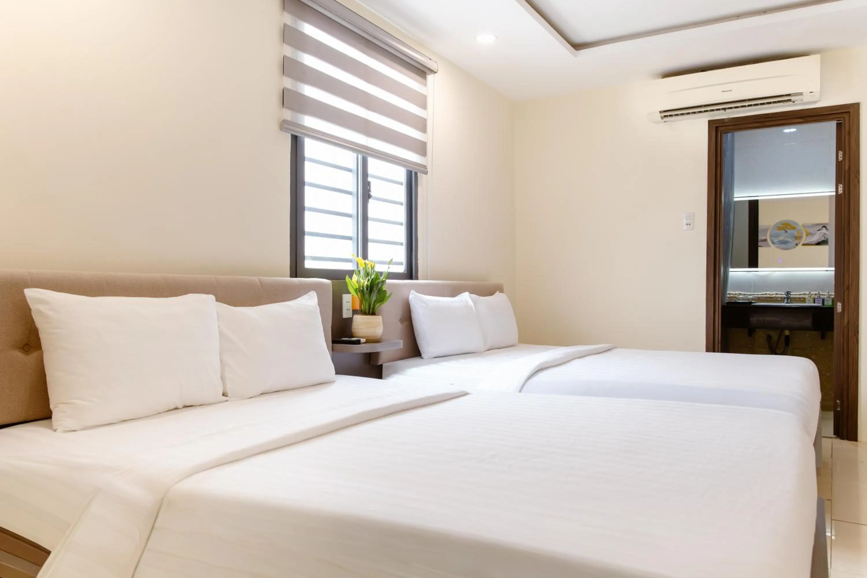 Bed in Boss Palace Hotel