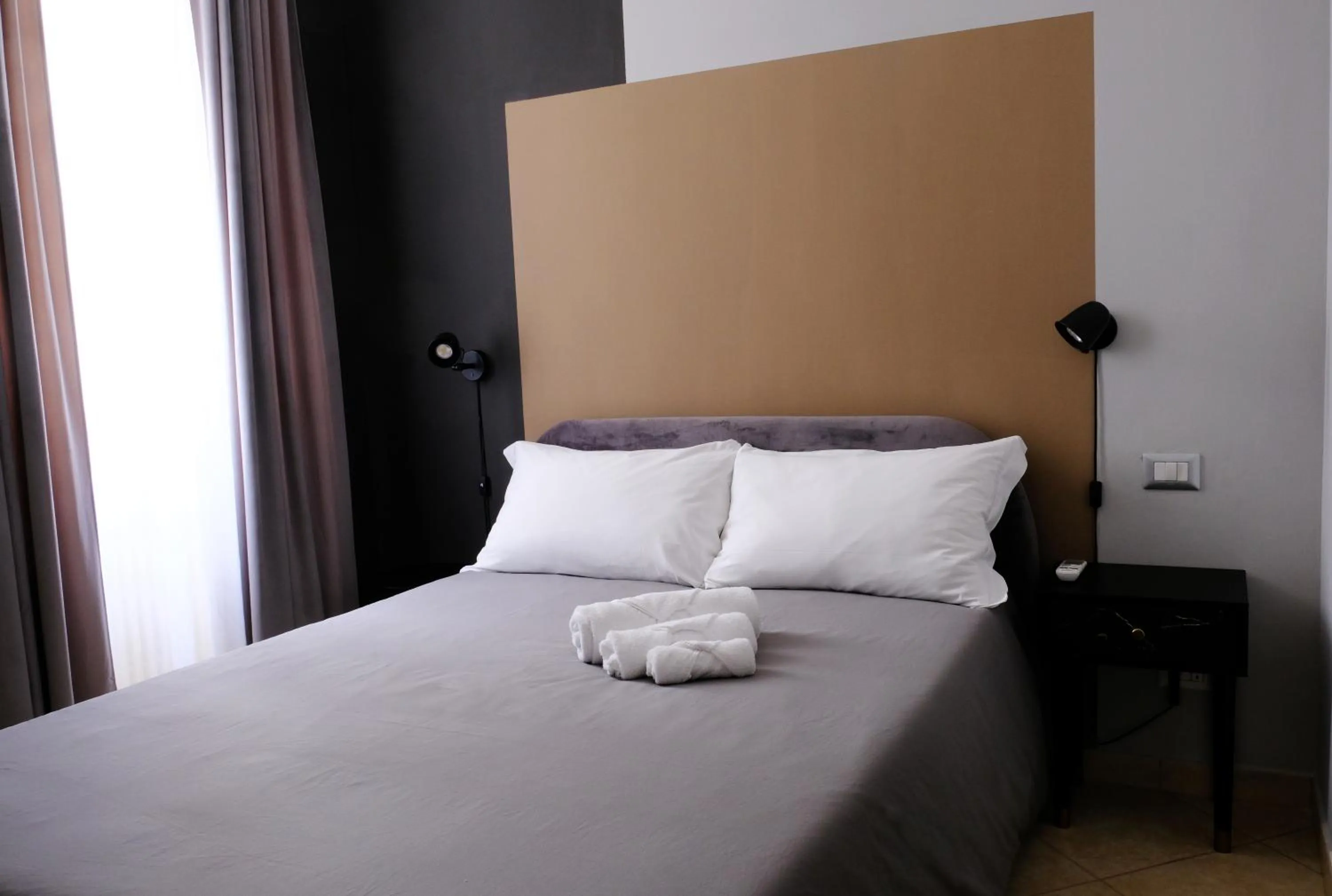 Property building, Bed in MATTEOTTI ROOMS