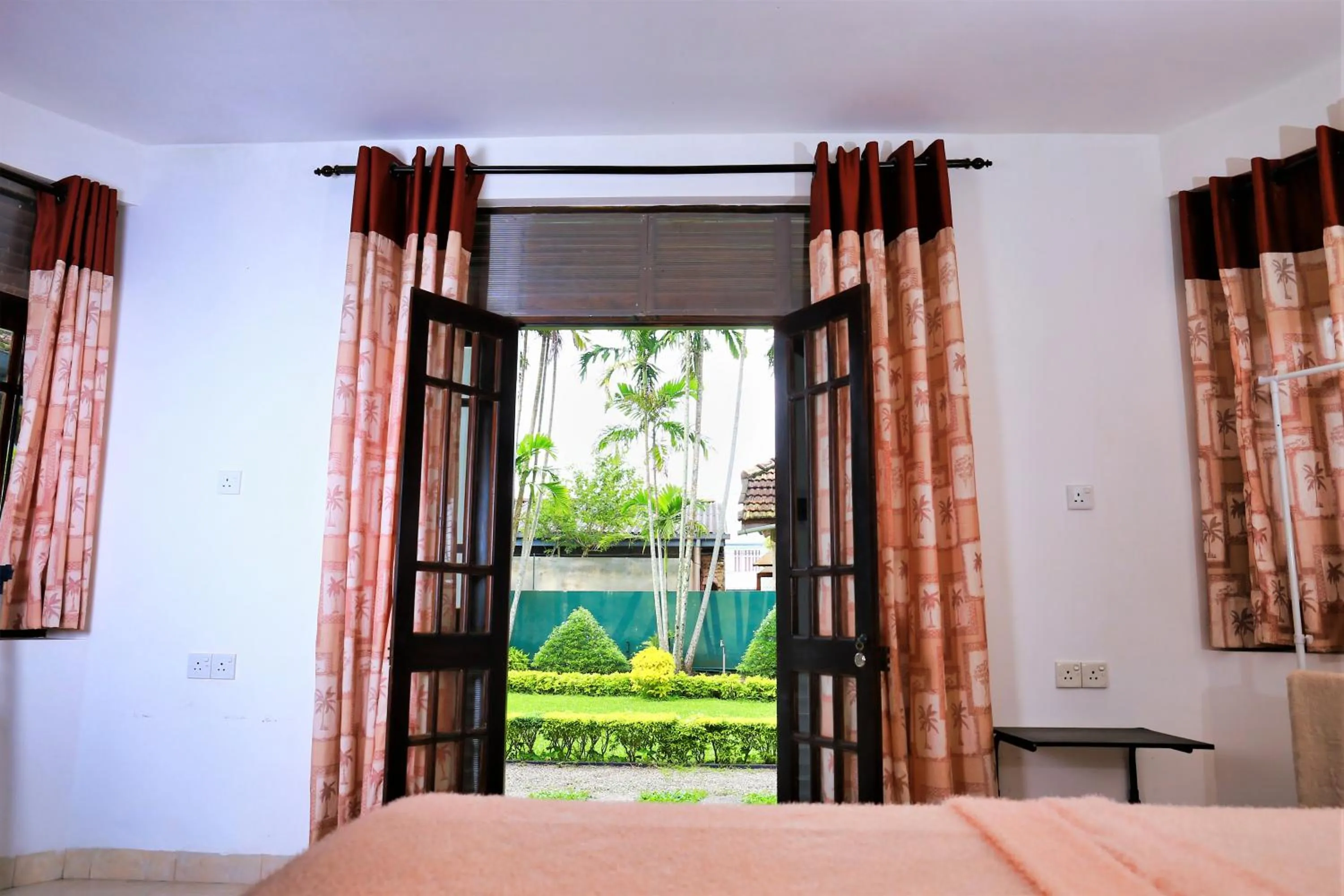Garden view, Bed in Camellia Dwelling