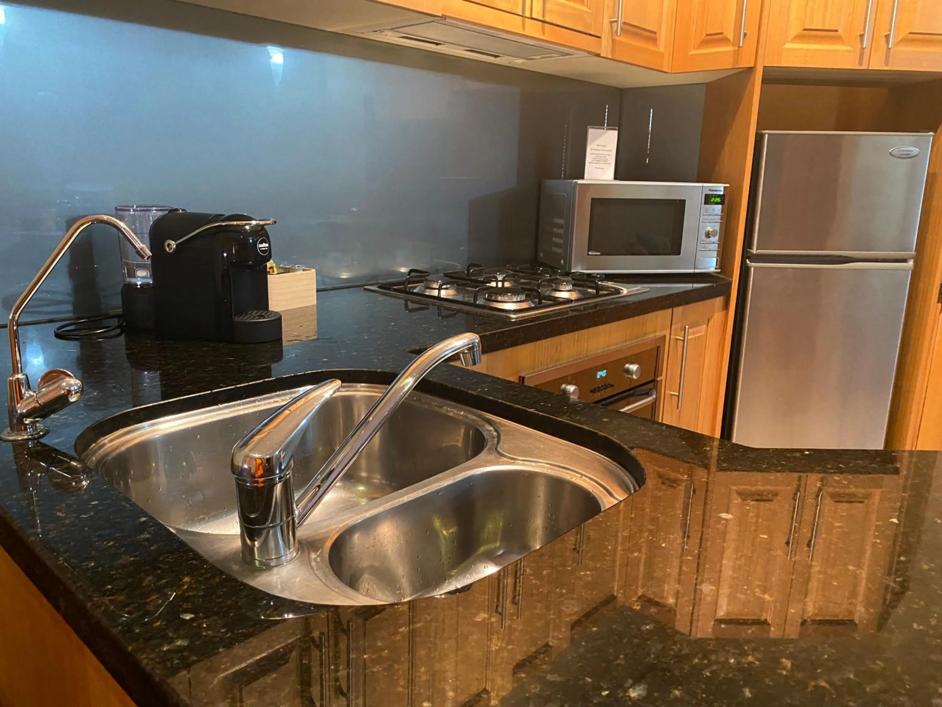 Kitchen or kitchenette in RIALTO SUITES Fremantle