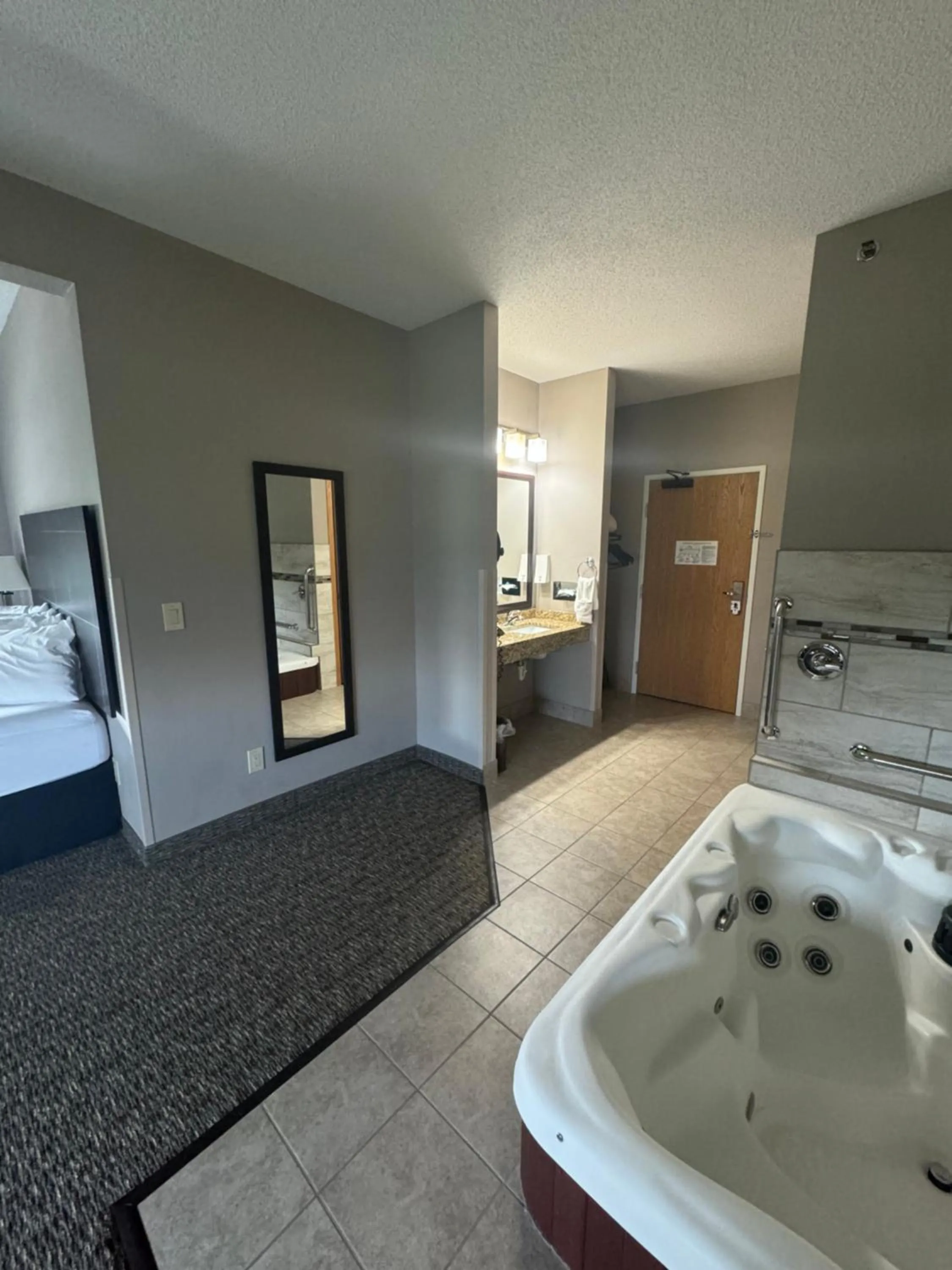 Bed in Garner INN & Suites