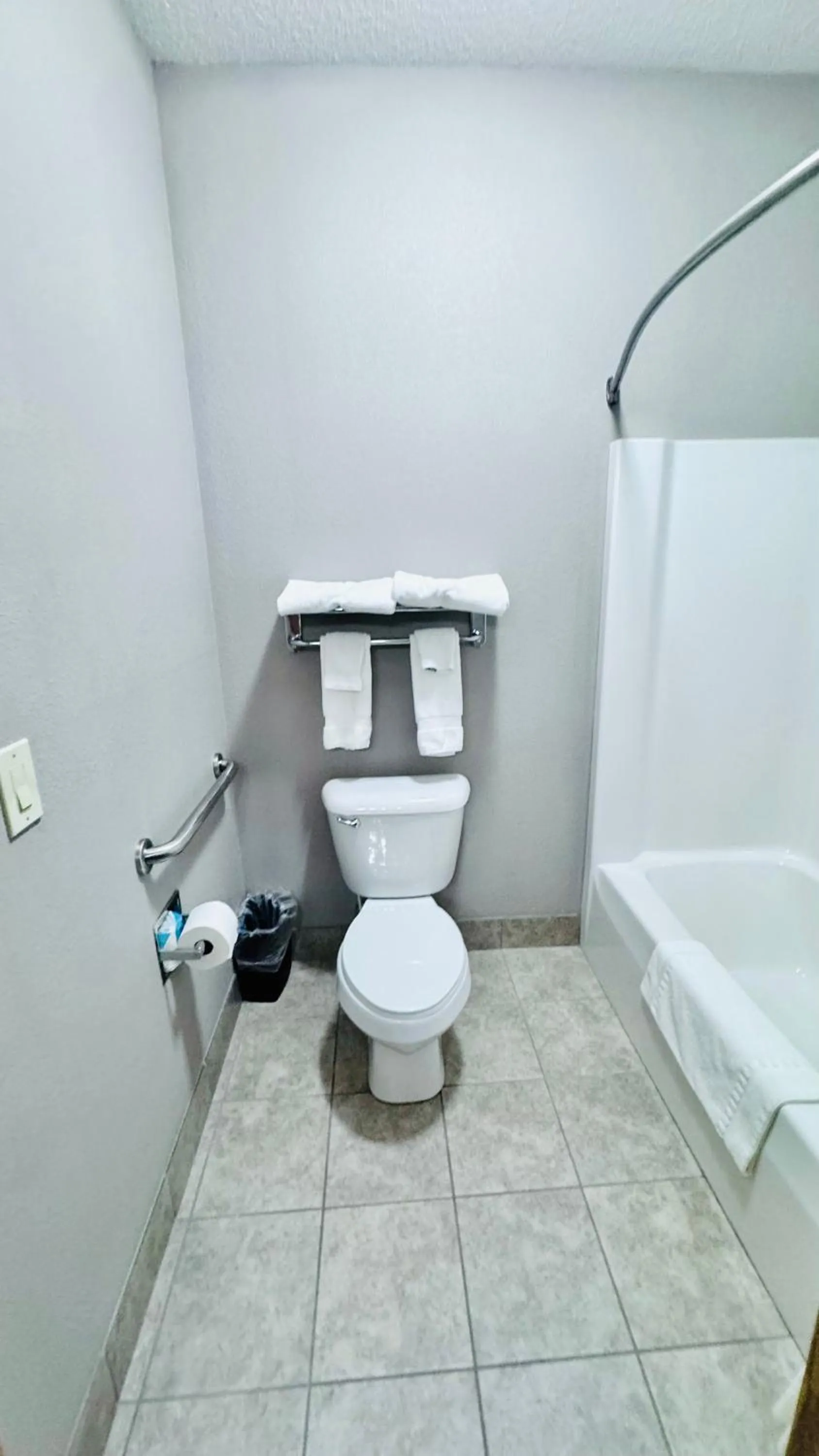 Toilet in Garner INN & Suites