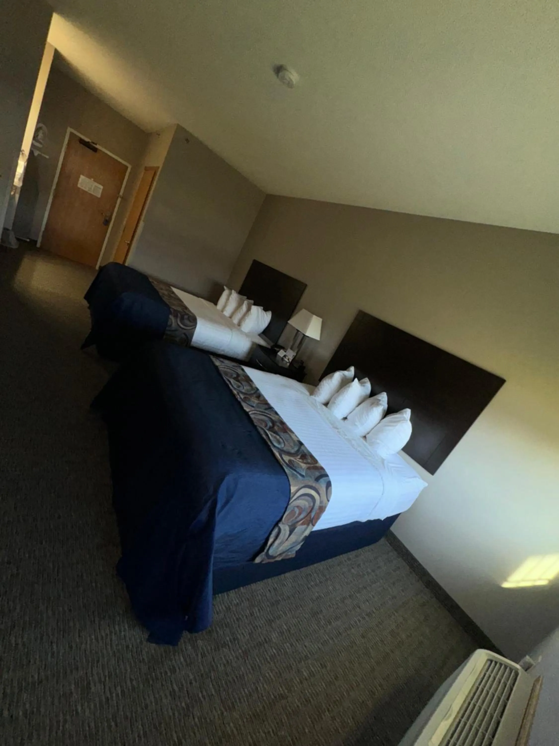 Bed in Garner INN & Suites