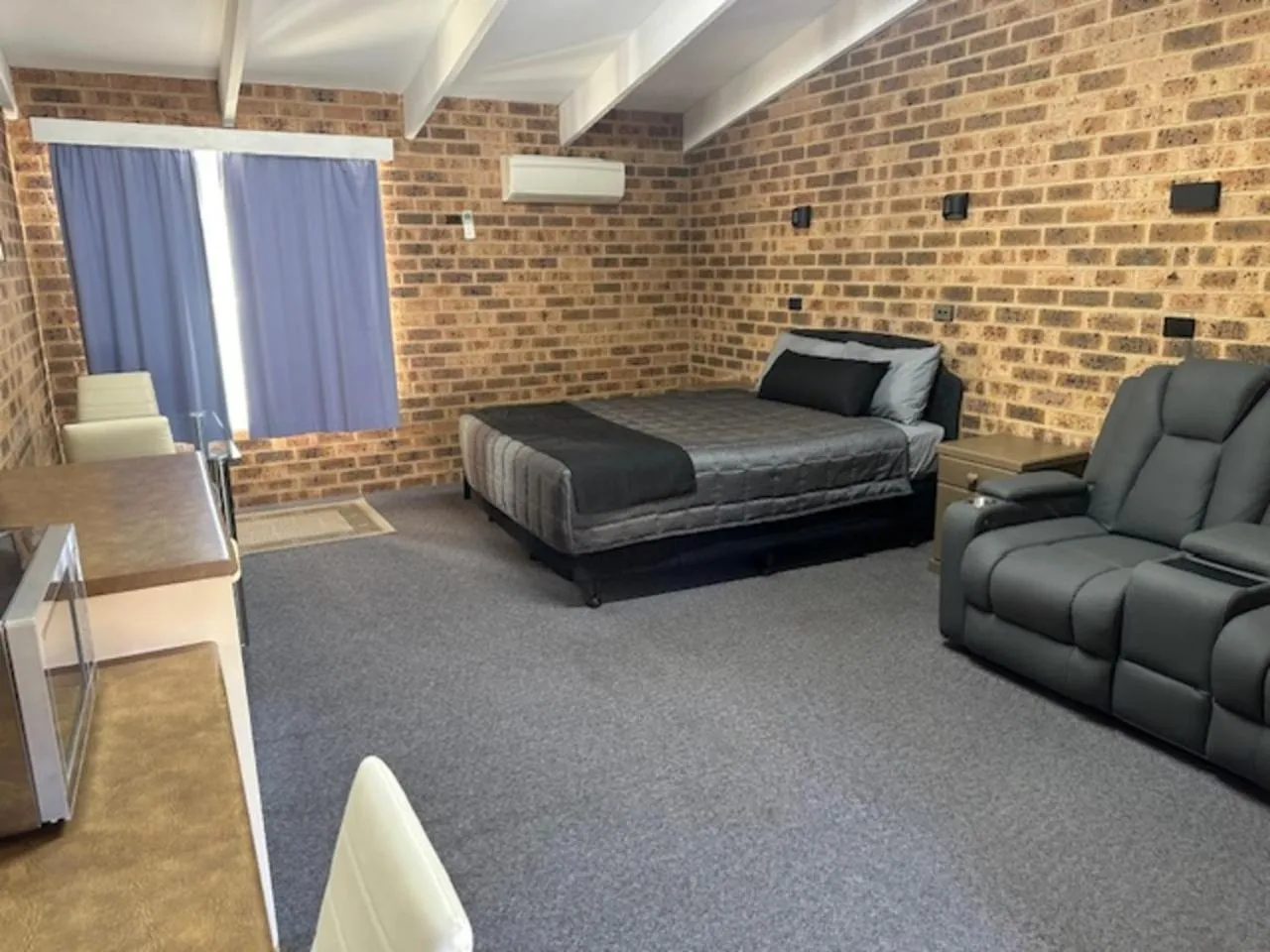 Bed in Clock Tower Motor Inn