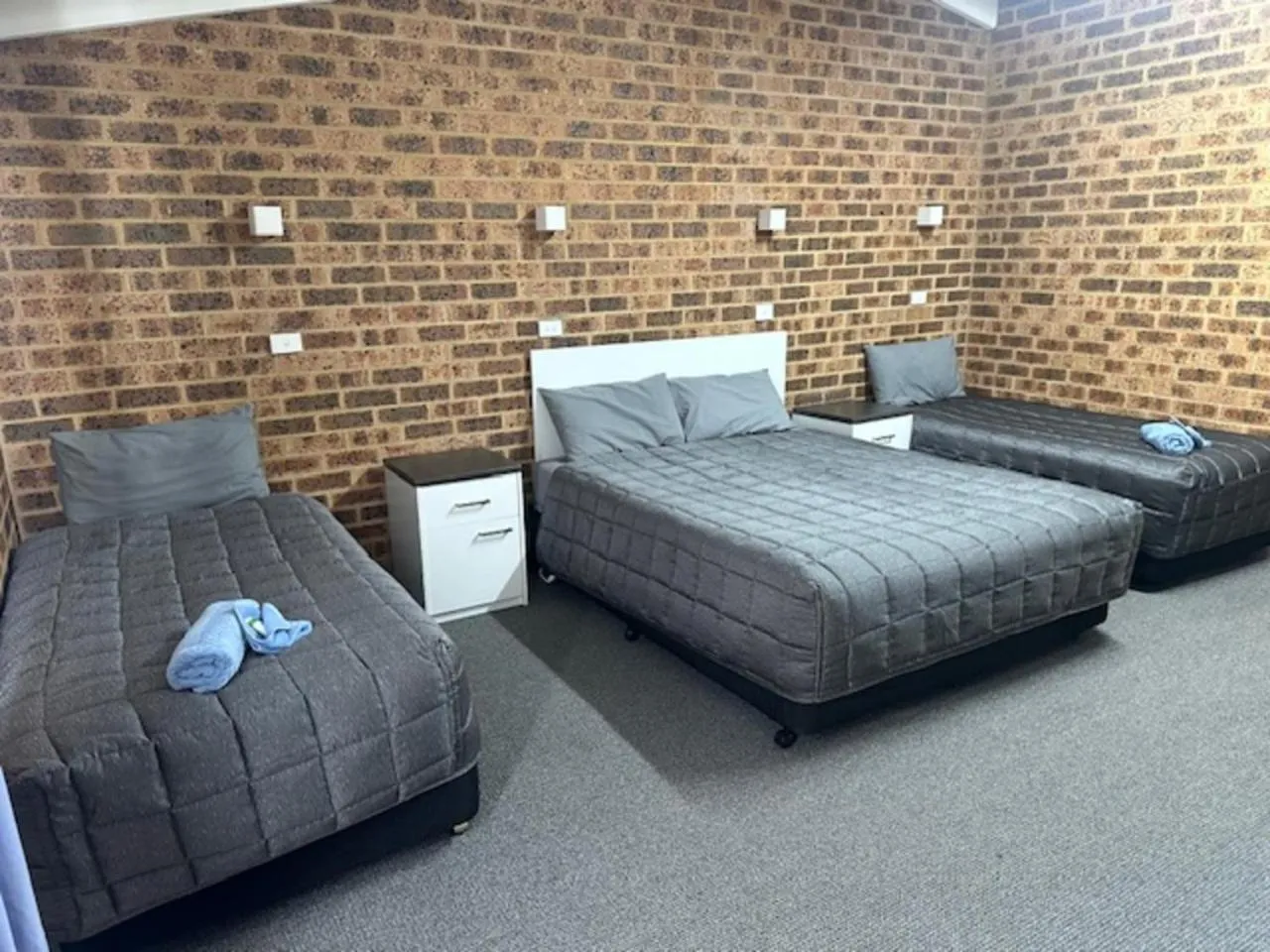 Bed in Clock Tower Motor Inn