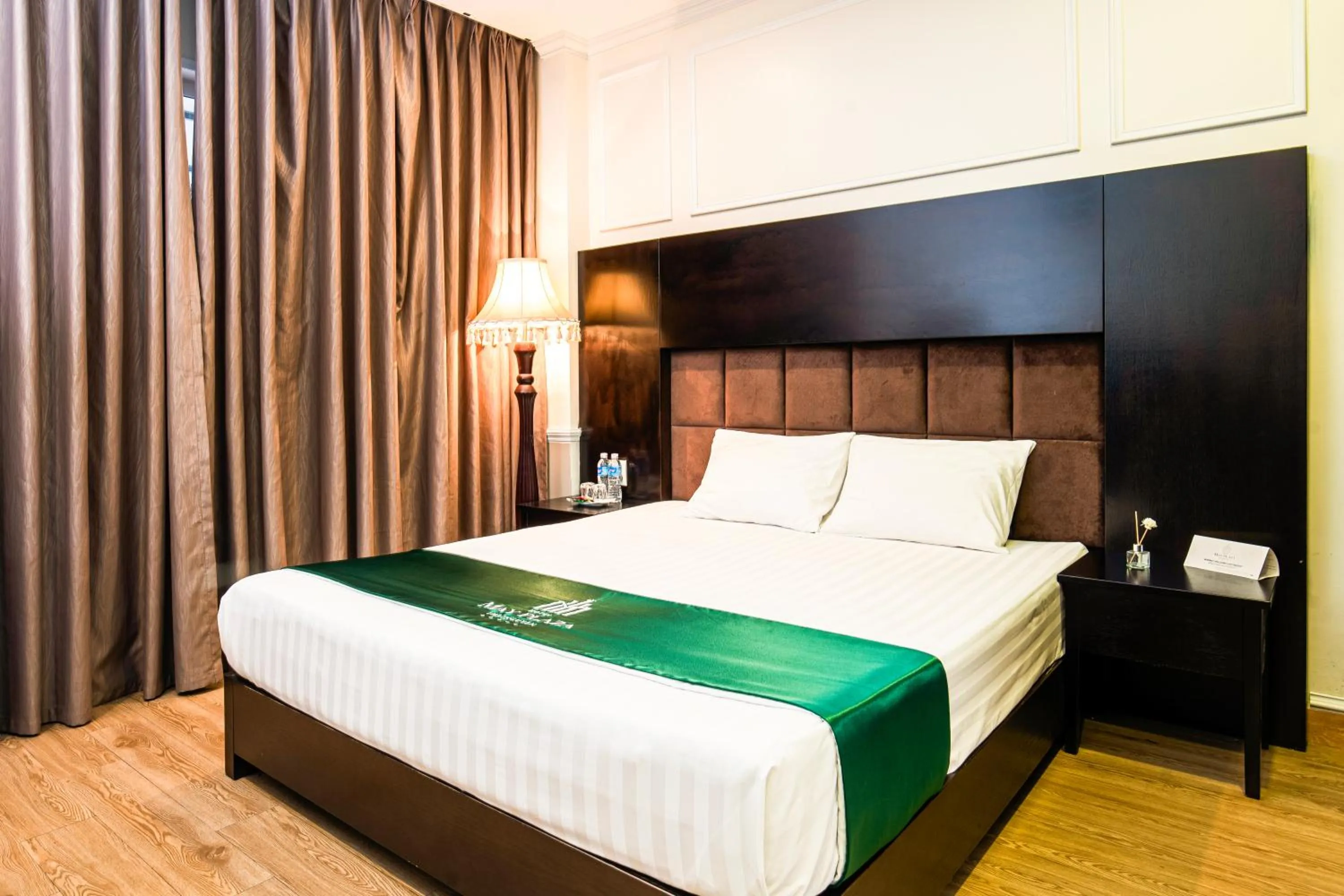 Bed in MAY PLAZA HOTEL