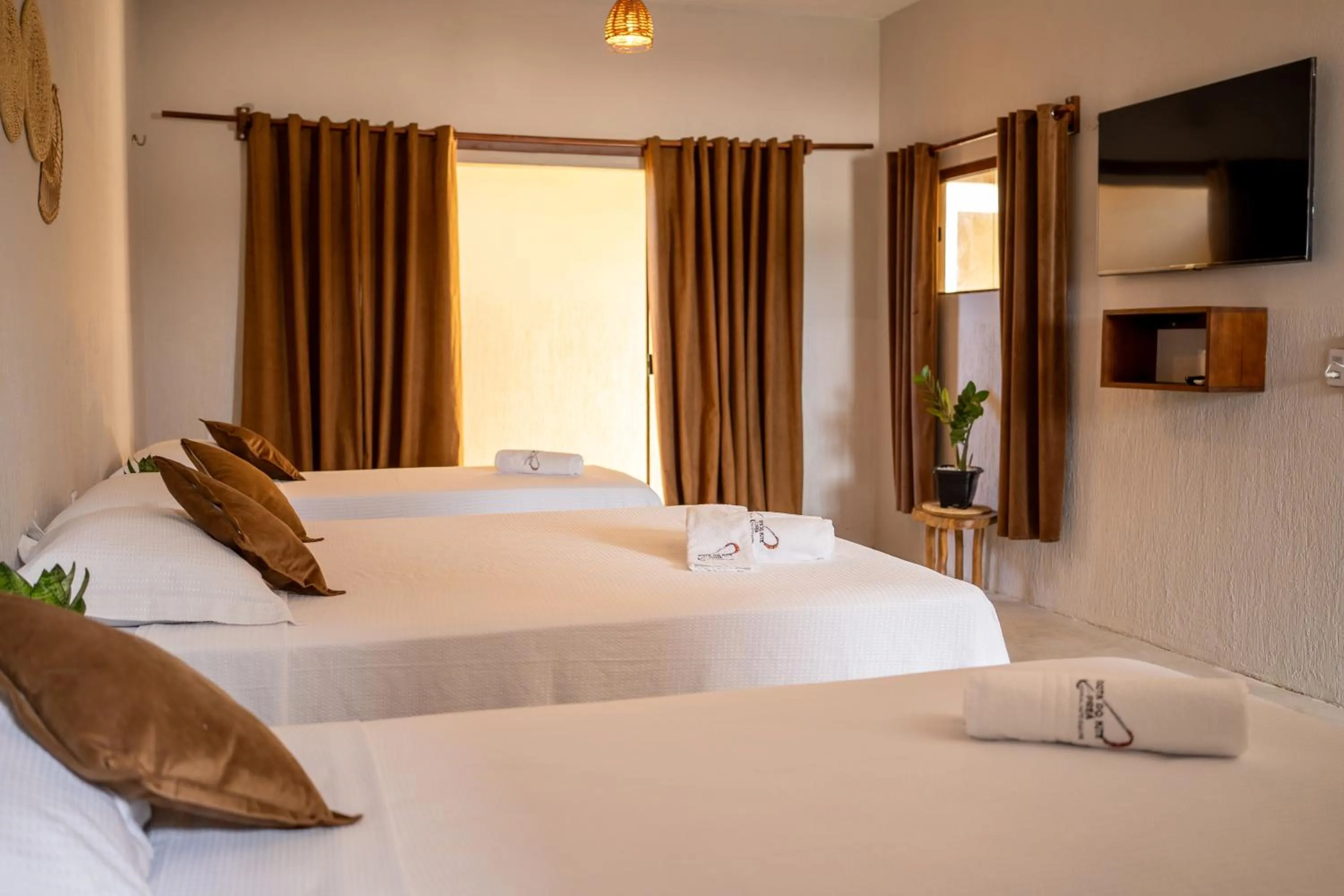 Bed in Pousada Rota do Kite Preá