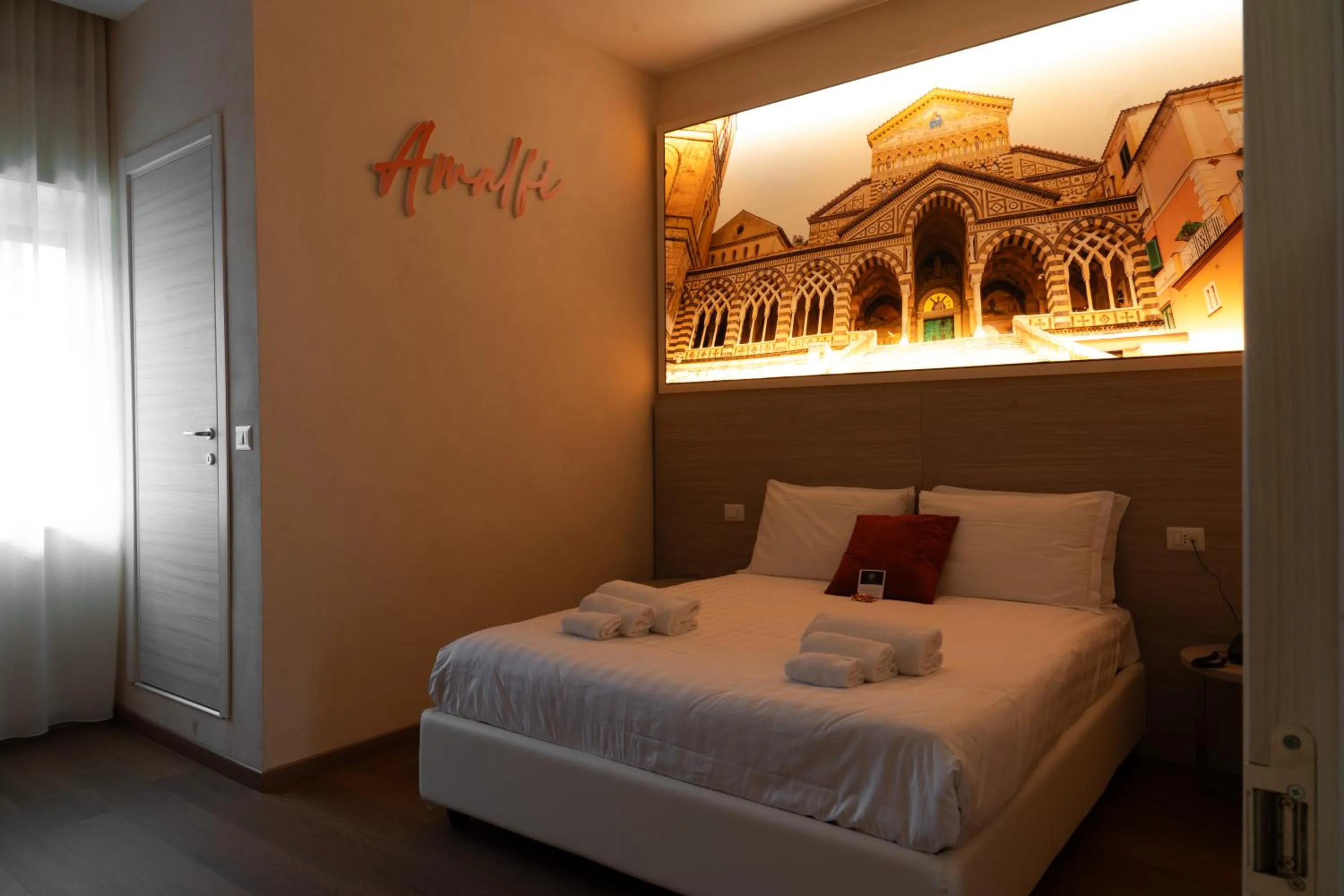 Bed in THE SUN HOTEL BOUTIQUE NAPOLI